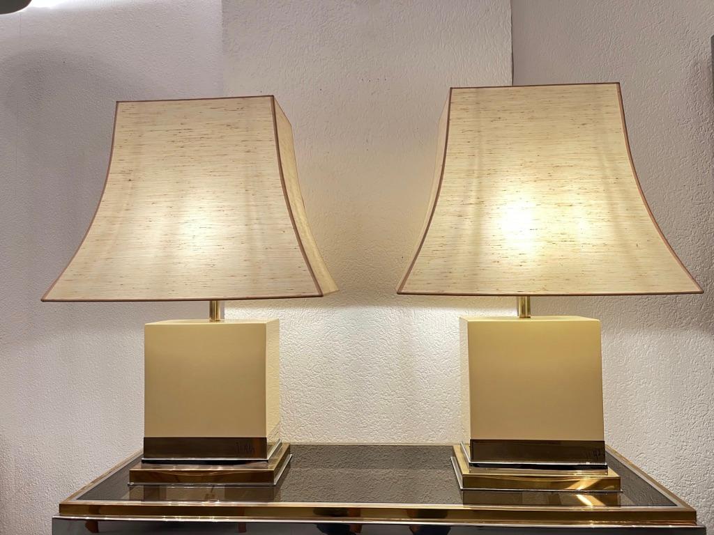 Pair of ivory white lacquered wood with brass and chrome trims table lamps by Jean Claude Mahey, France ca. 1970s
Perfect condition originals pagoda shape shades.
Dimensions of lamps with shades : H 75 x D 35 x L 50 cm
Signed on the bottom.
Very