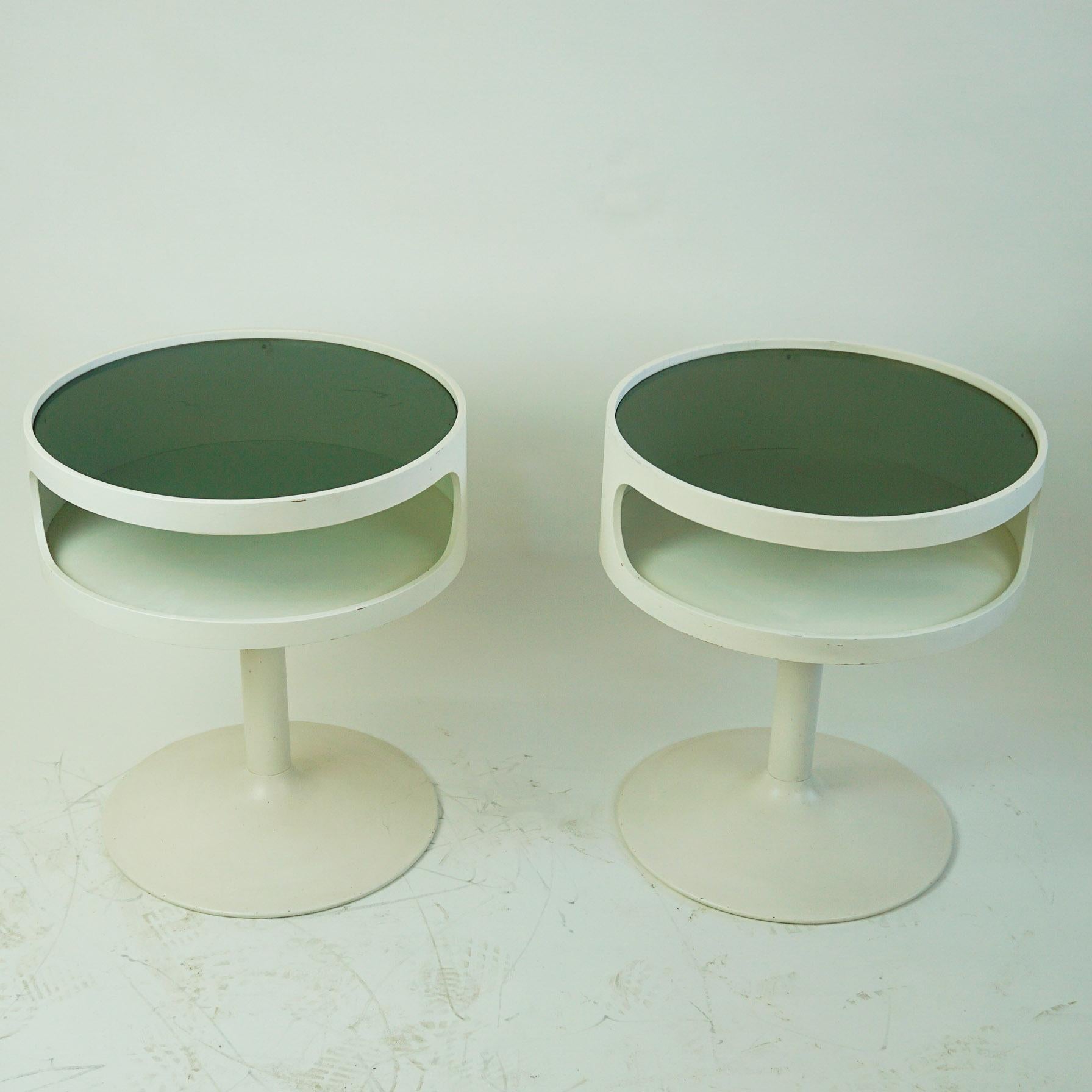Charming white lacquered circular side tables with metal tulip base and glass top in very nice condition. The tables are produced in Germany by Opal Kleinmöbel in the late 1960s and one of them still shows the original manufacturers label on the