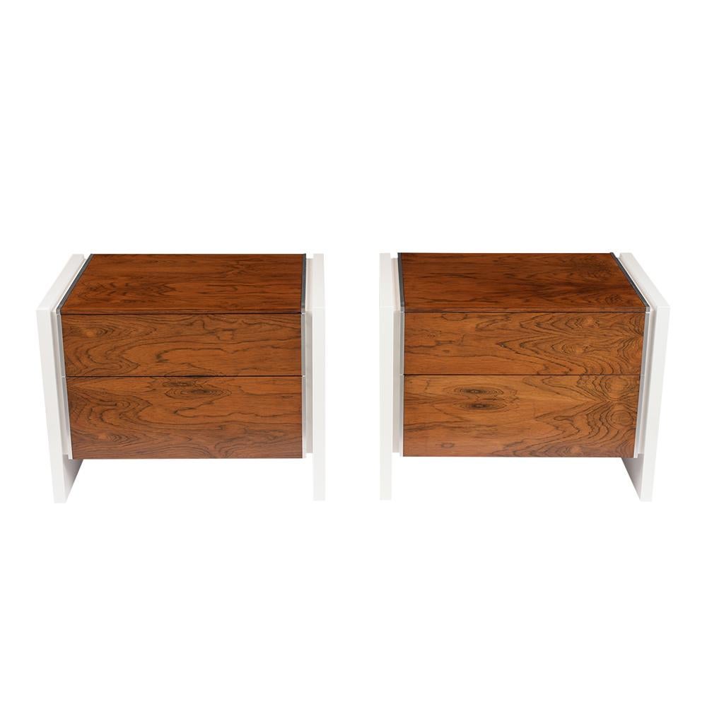 This Pair of Mid-Century Modern Glenn California Nightstands are made out of walnut and rosewood and have been completely restored. The set features a new white color lacquered finish, floating leg design, flat chrome molding details, and the top &