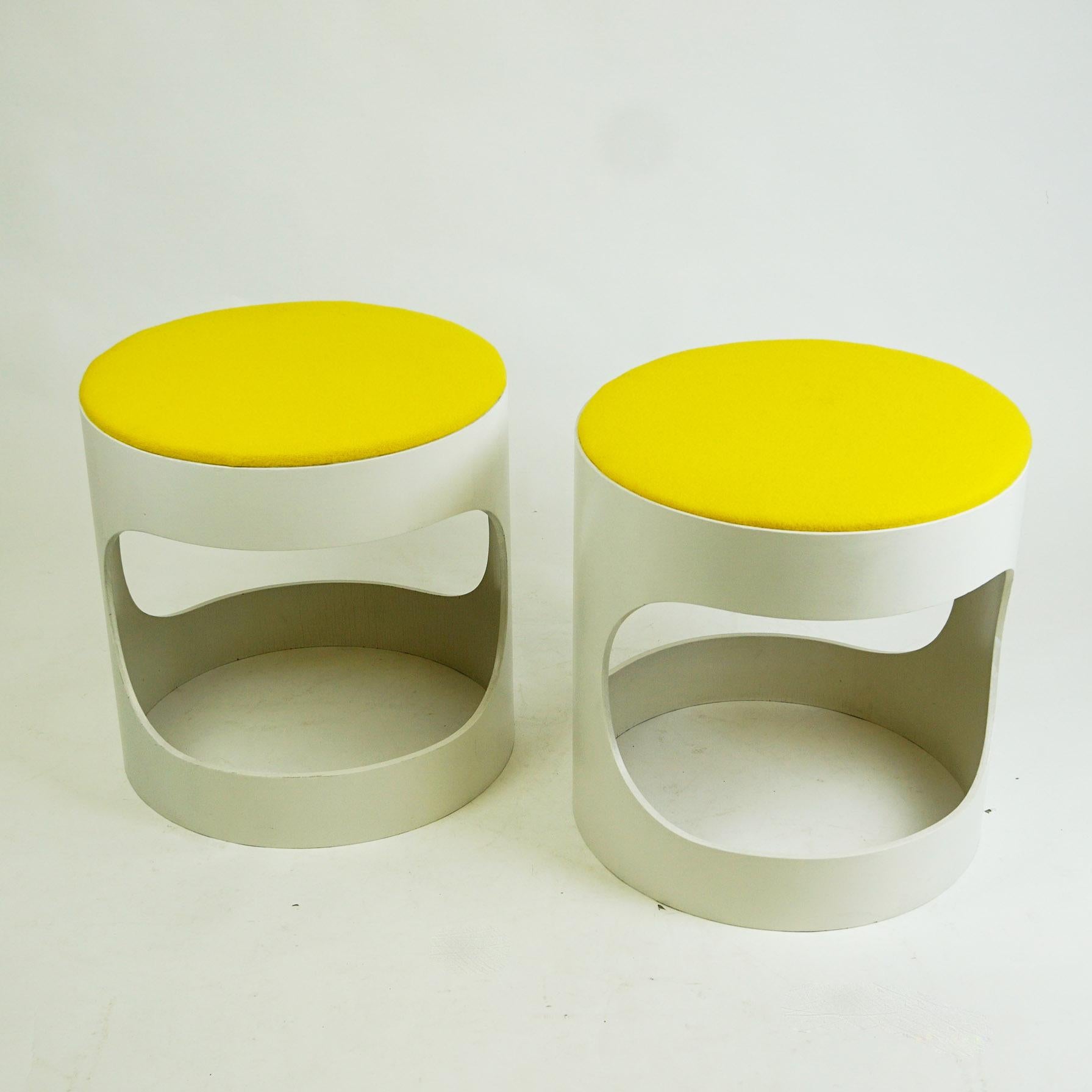 Charming white lacquered plywood circular stools. They are produced in Germany by Opal Kleinmöbel in the late 1960s and show the original manufacturers mark on the underside. The lacquer has been renewed and the seats are covered with a renewed