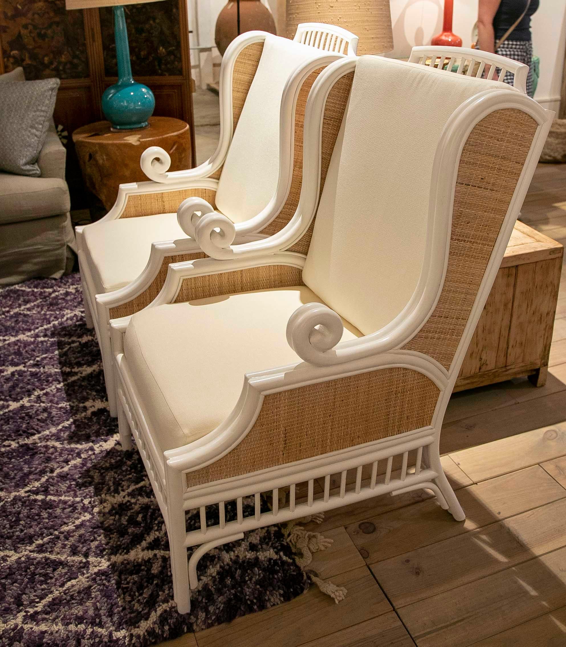 Contemporary Pair of White Lacquered Rattan Armchairs Lined on the Sides with Cushions For Sale