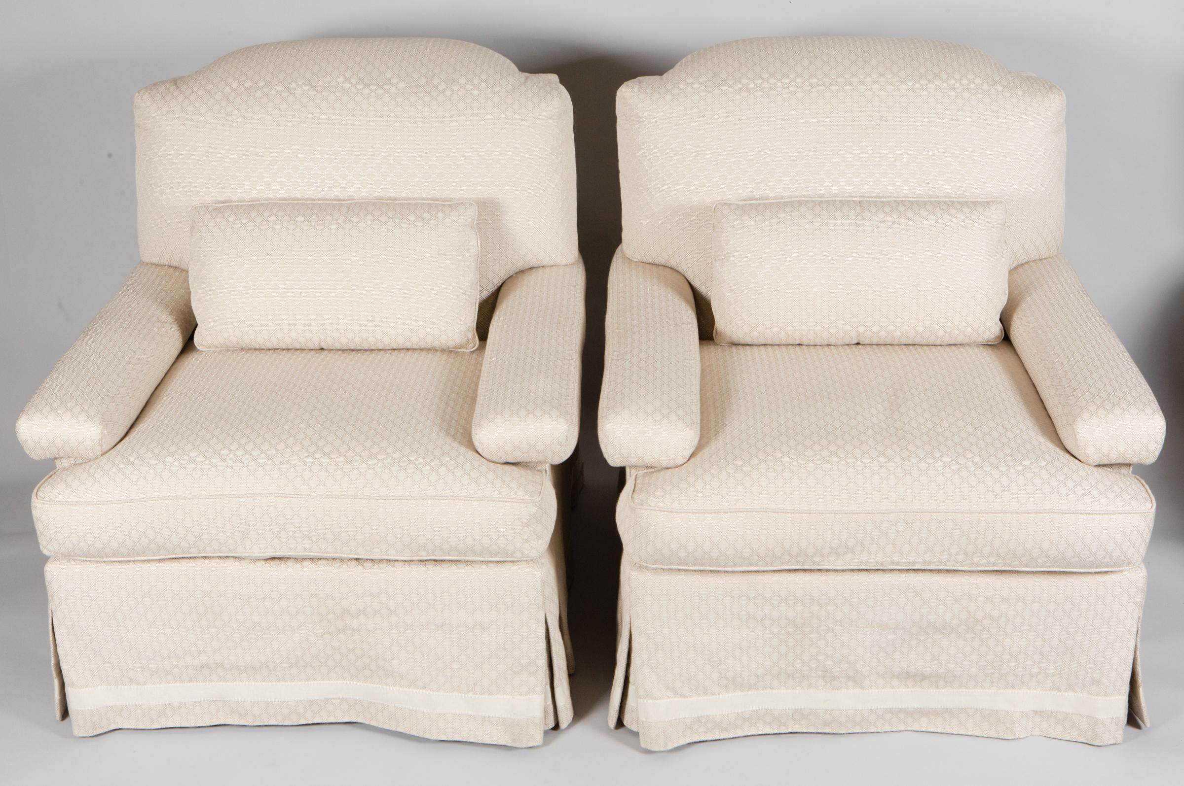 Pair of white linen club chairs, linen fabric has subtle geometric design.