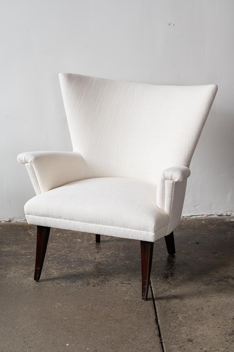 Pair of white linen wingback chairs, newly upholstered.