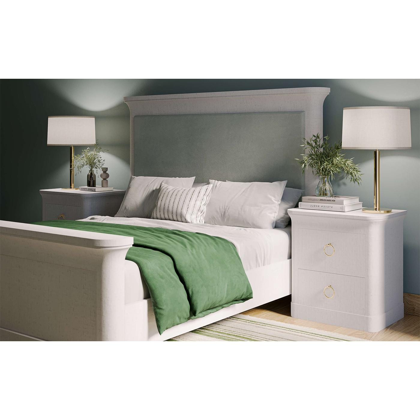 This exquisite piece features a sleek, minimalist design wrapped in luxurious dove white linen, bringing a touch of sophistication to any space. 

The two spacious drawers, adorned with elegant gold ring pulls, provide ample storage for your