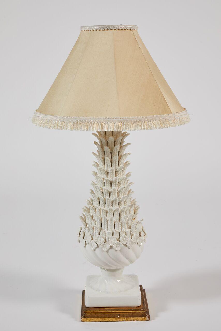 Pair of white Manises glazed pottery table lamps, 1960s porcelain, Spanish.
Paid $518.35
Beautiful pair of white glazed Manises ceramic lamps with organic form covered in leaves and sitting atop giltwood pedestals. Manises, Spain had a long