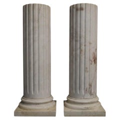 Pair of white marble columns, 102 cm high