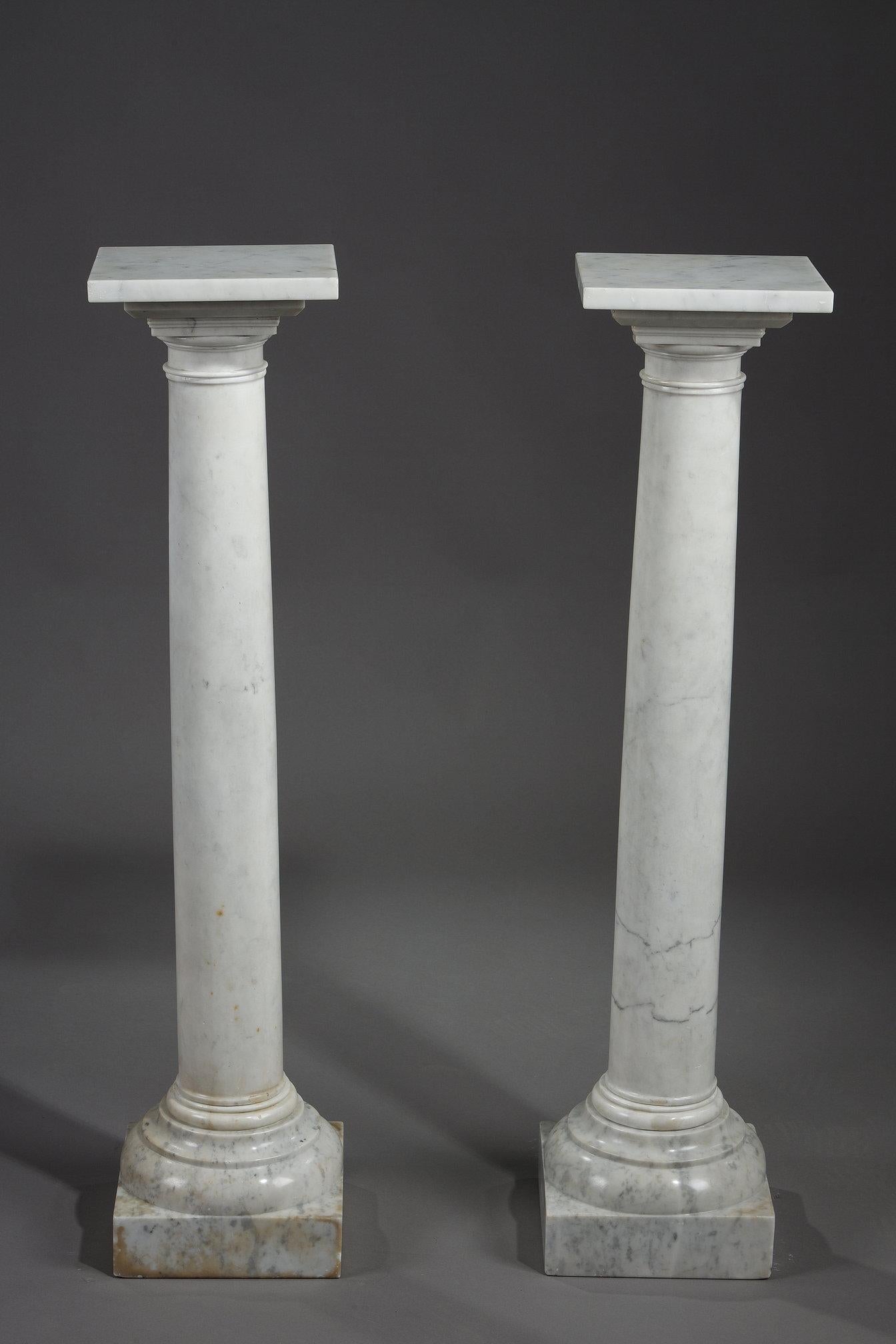 Pair of columns in white marble with natural gray veins, ideal for setting white marble sculptures. French work from the late 19th century.

Condition report: In good condition with chips at the base.
