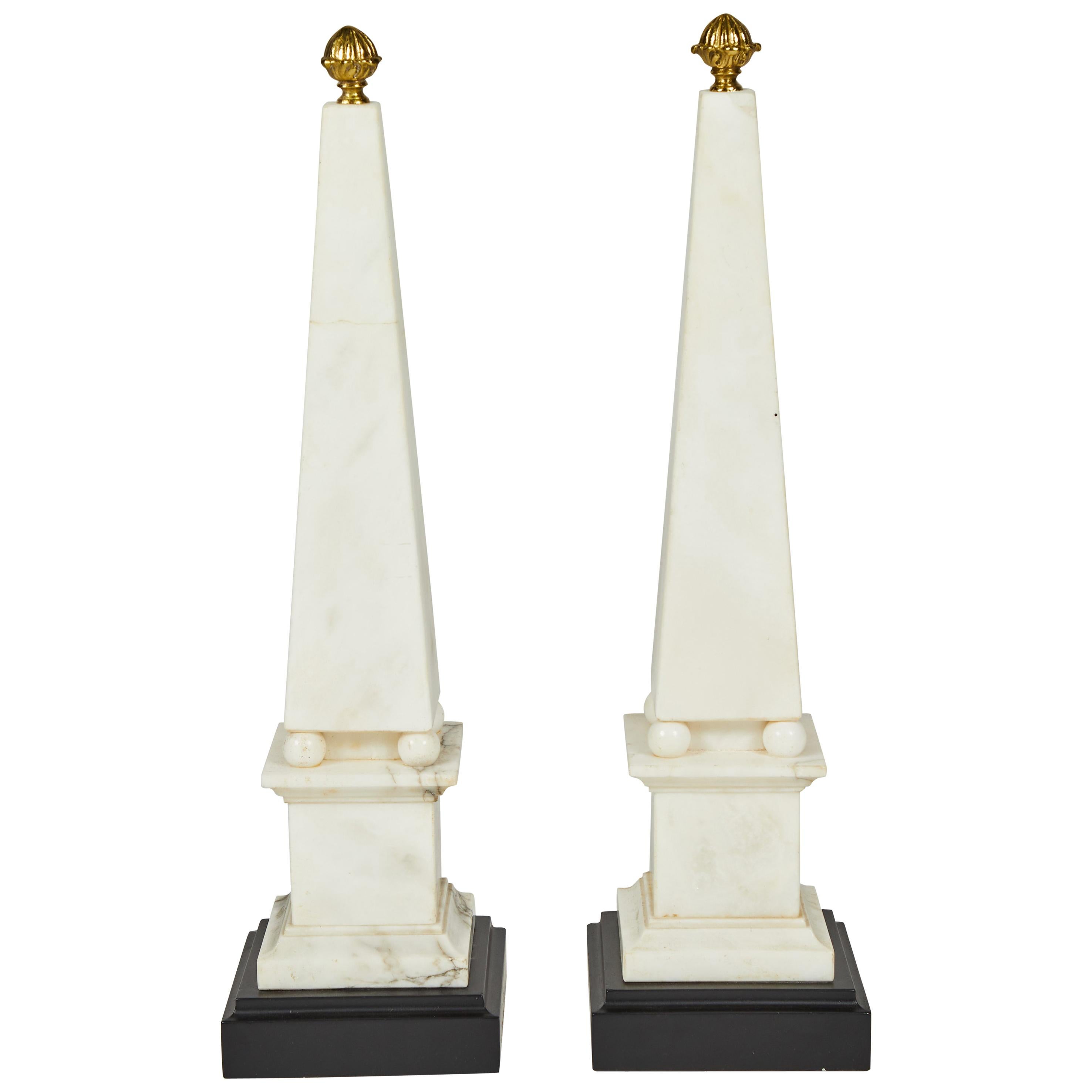 Pair of White Marble Obelisks on Painted Wood Bases with Brass Acorn Finials For Sale