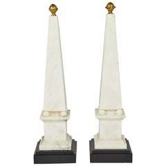 Pair of White Marble Obelisks on Painted Wood Bases with Brass Acorn Finials