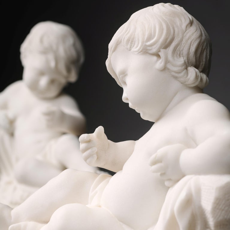 A fine pair of white marble sculptures of reclining putti.

Each putto figure finely carved and raised on a marble base with gilt-bronze mounts and feet. 

French, Circa 1890.
