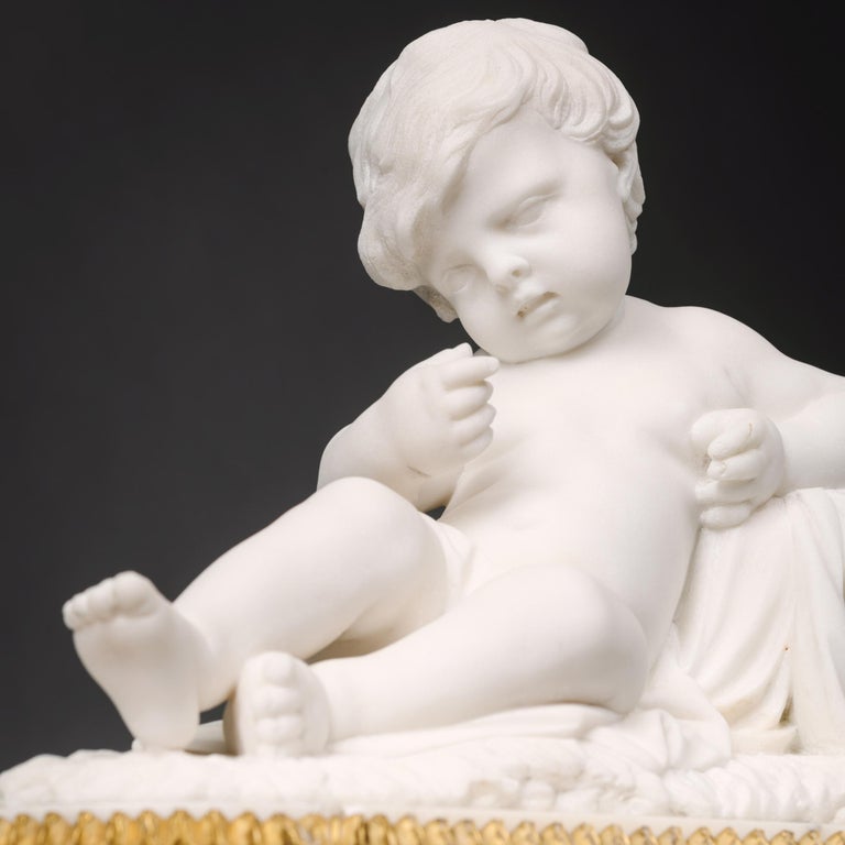 Pair of White Marble Sculptures of Reclining Putti For Sale 1