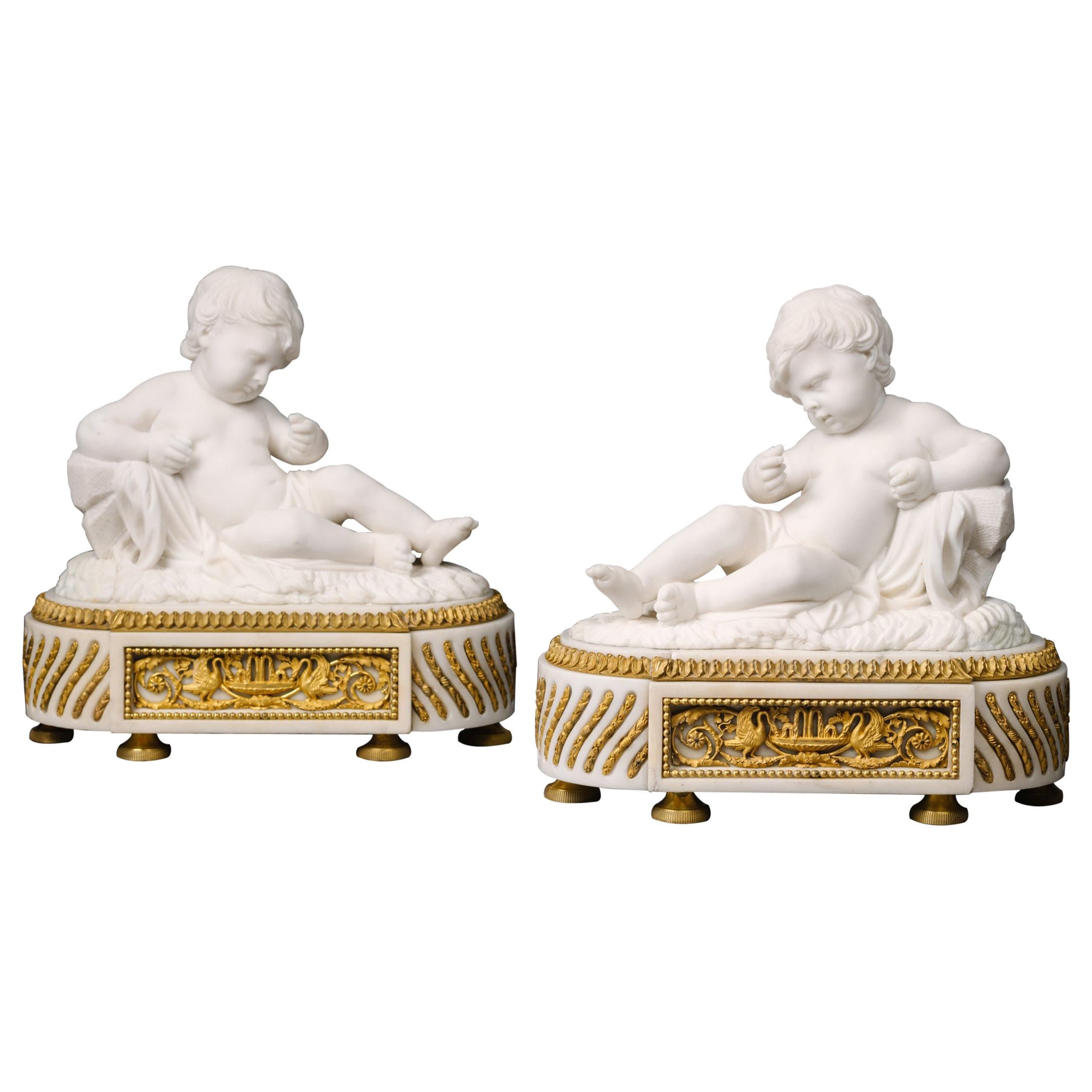 Pair of White Marble Sculptures of Reclining Putti