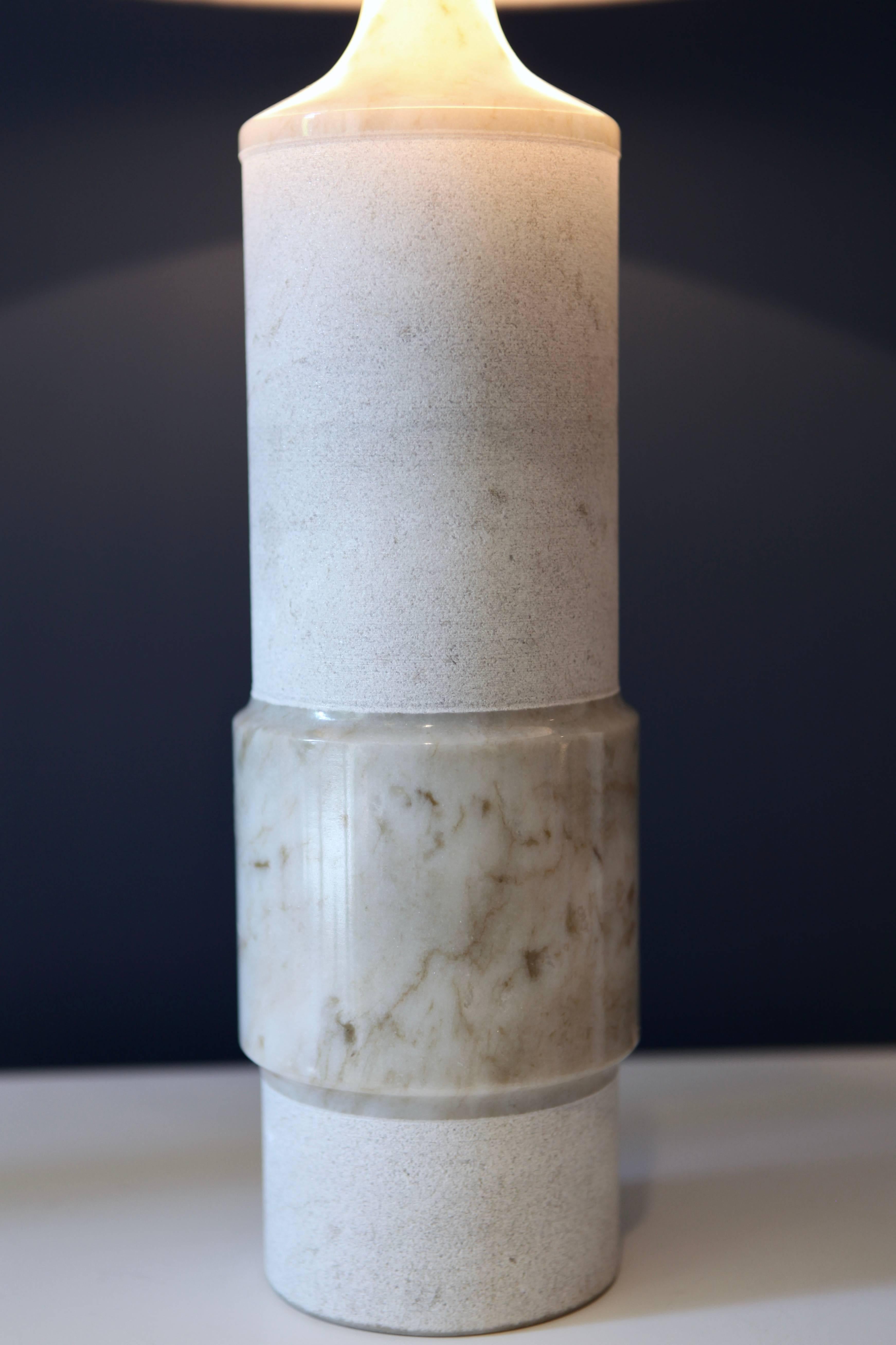 A pair of Mid-Century Modern white marble table lamps
cylindric form
New shades
Rewired
The larger is 69cm high the smaller 38cm including the shade
Manufactured in Sweden in the 1960s
Paper label Ekebergsmarmor
Excellent condition.
 