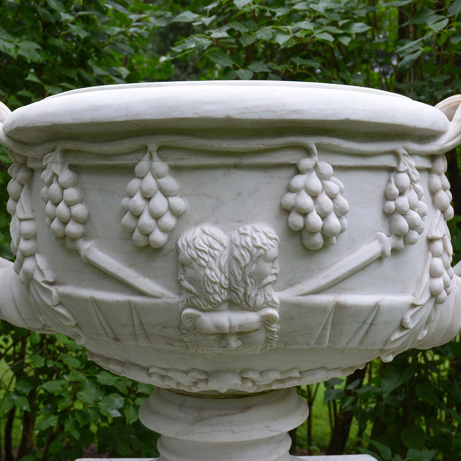 Carved Pair of White Marble Urns on Tall White Marble Pedestals For Sale