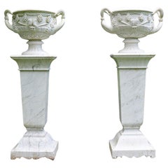 Pair of White Marble Urns on Tall White Marble Pedestals