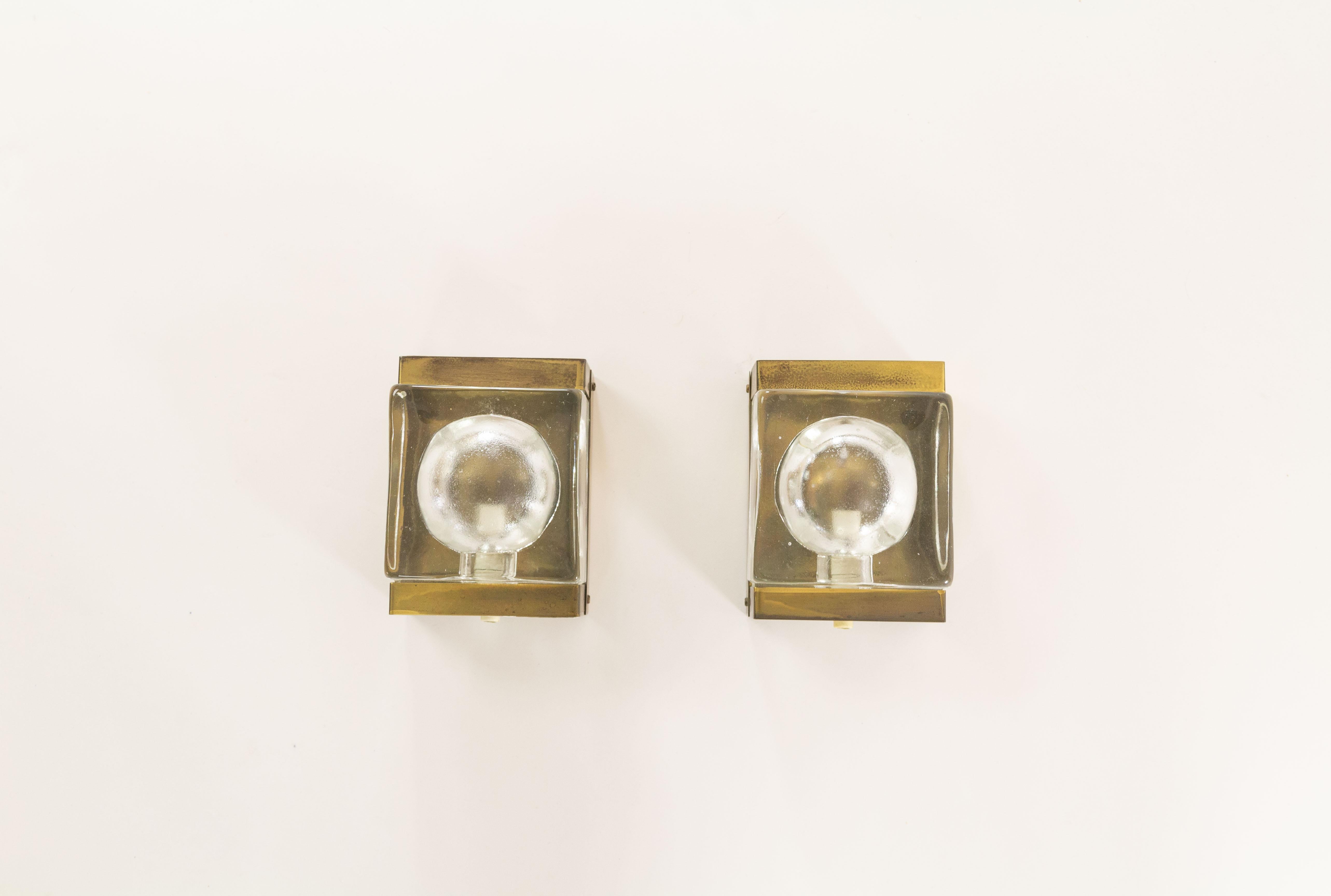 A set of two rare white Maritim Lampet wall lamps, produced by Danish lighting manufacturer Vitrika in the 1970s.

Both lamps consist of two parts: a solid and so rather heavy handmade glass body (2.4 kg / 5.3 lbs) and the brass holder.

Price