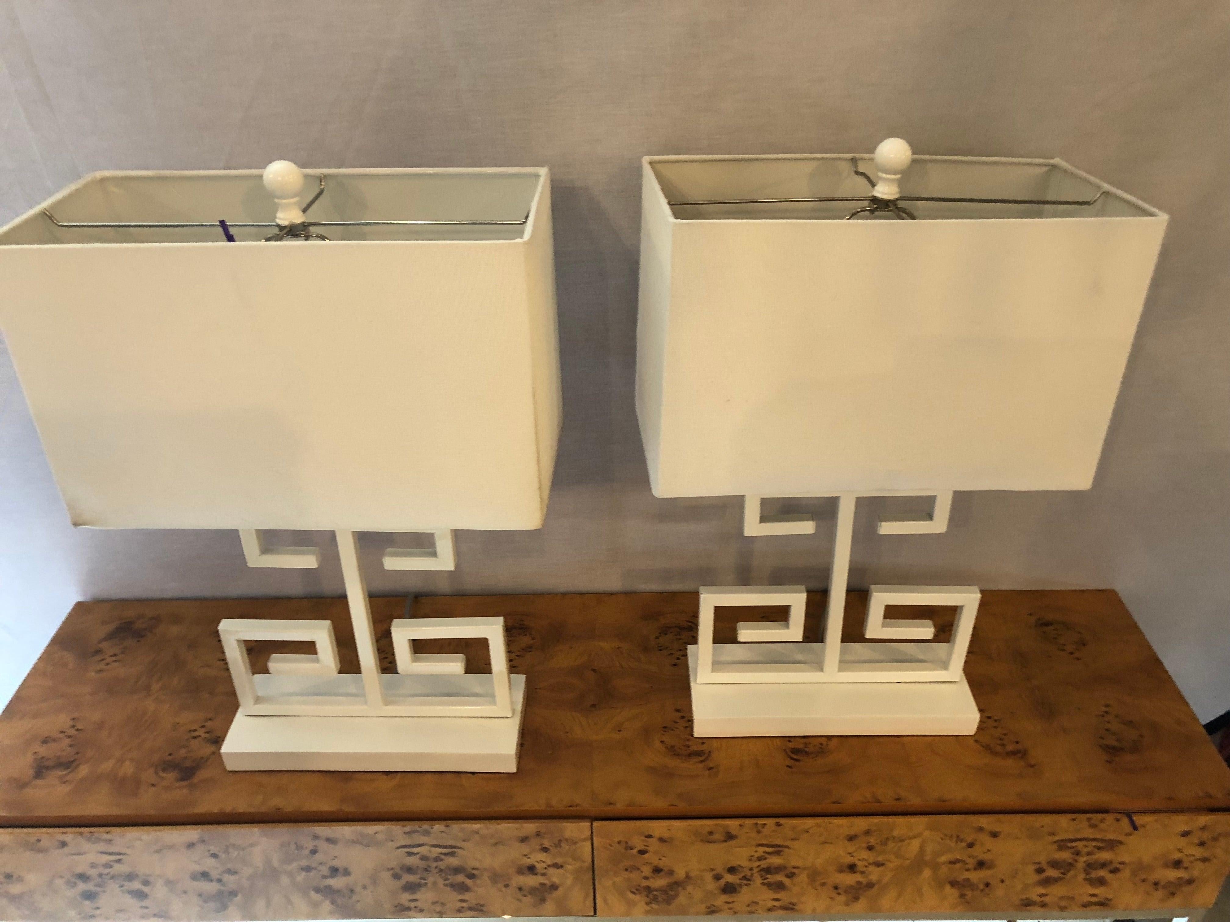 Pair of white modern Art Deco style table lamps with shades. Having a sleek and stylish design these geometric table lamps are certain to 
