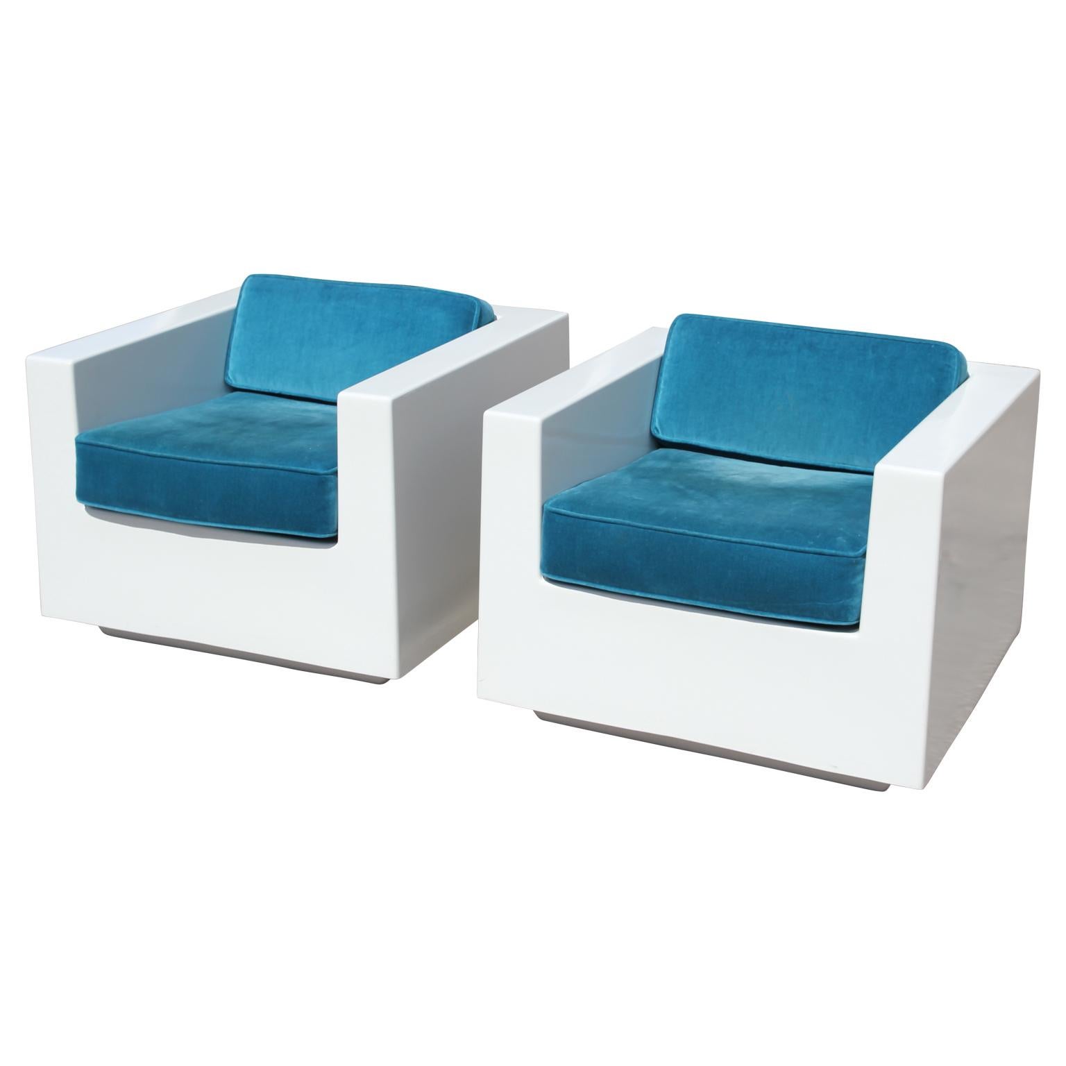 Pair of white modern cube fiberglass armchairs with teal velvet seats. These chairs are stunning in person. The upholstery is worn and needs updating. We reupholster for around $295 each. Possibly Italian.