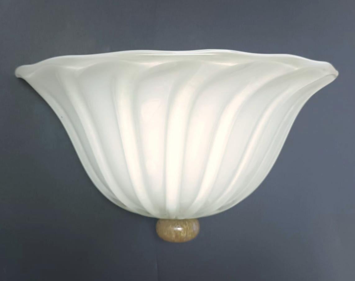 Vintage Italian wall lights with ribbed milky white hand blown Murano glass shades / Made in Italy in the style of Barovier e Toso, circa 1960s 
Measures: width 13 inches, depth 8 inches, height 7 inches
2 lights / E12 or E14 type / max 40W each
1