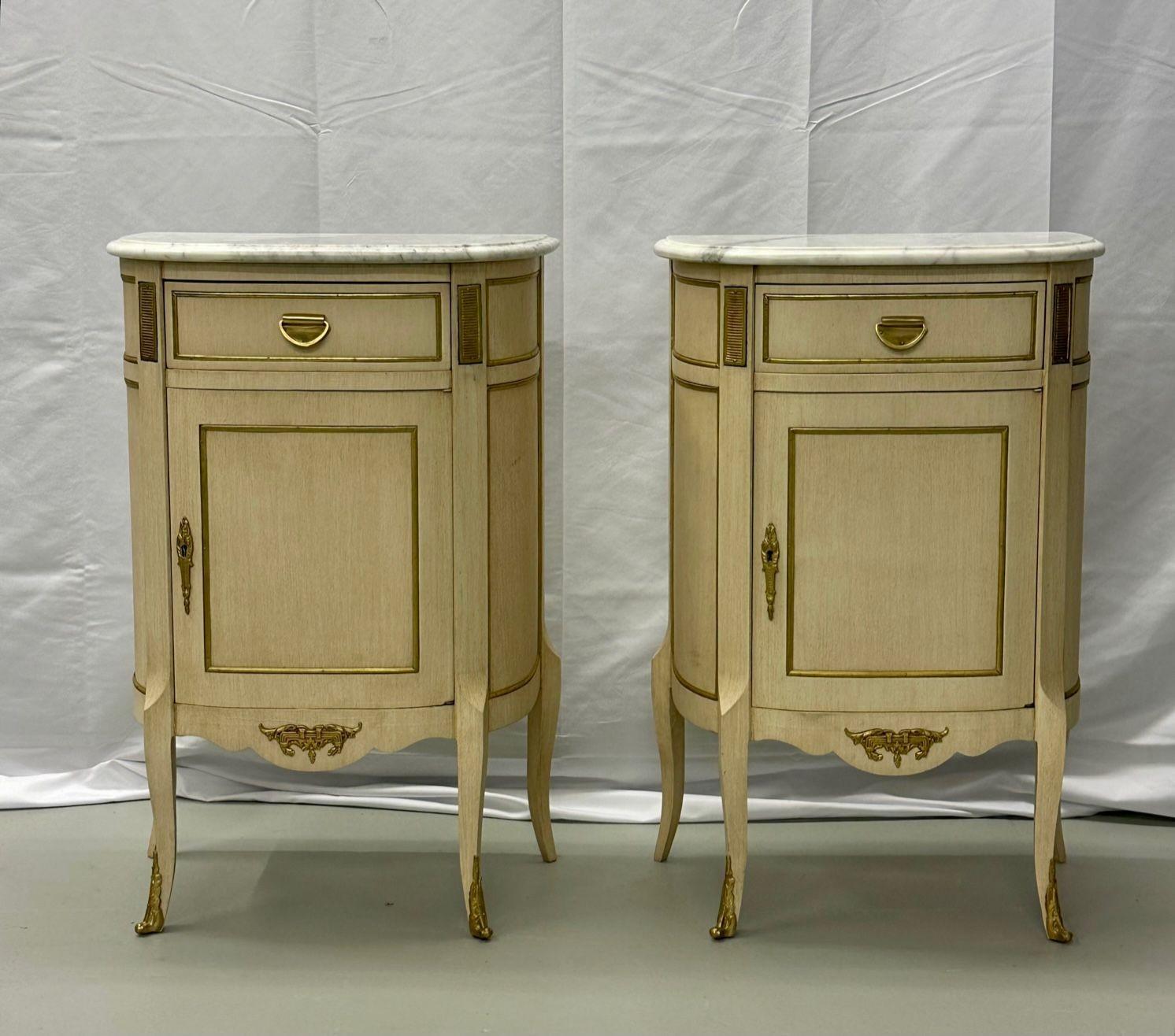 Pair of white nightstand or end tables / side tables, marble top Louis XV style, Demi Lune.
A fine demi lune shaped constructed pair of off white painted marble top Louis XV style nightstands, side tables or/ end tables. Each in the Louis XV style