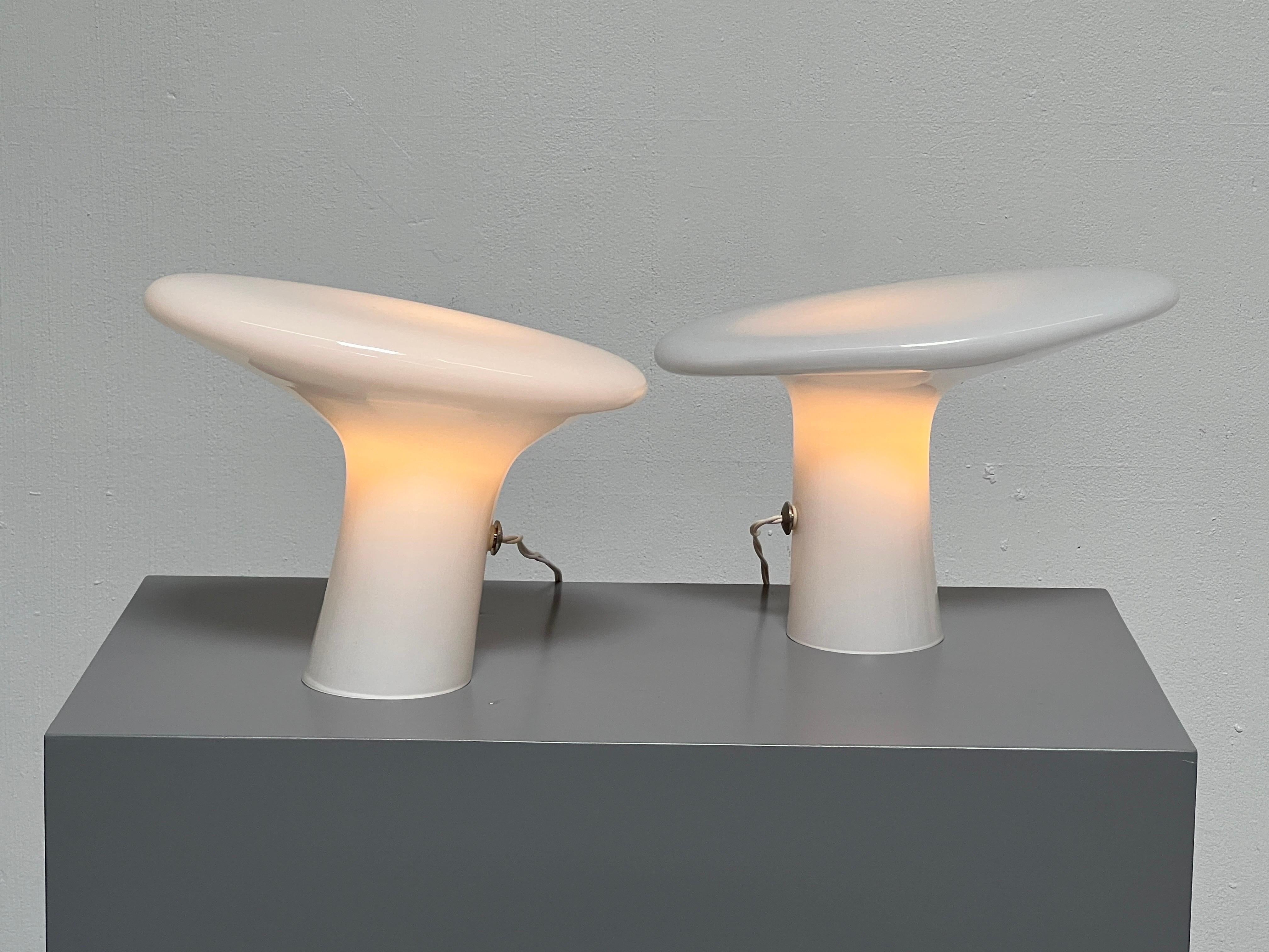 Pair of Vistosi white opaline glass table lamps from the 70's. Each lamp is unique and vary in size/shape. 