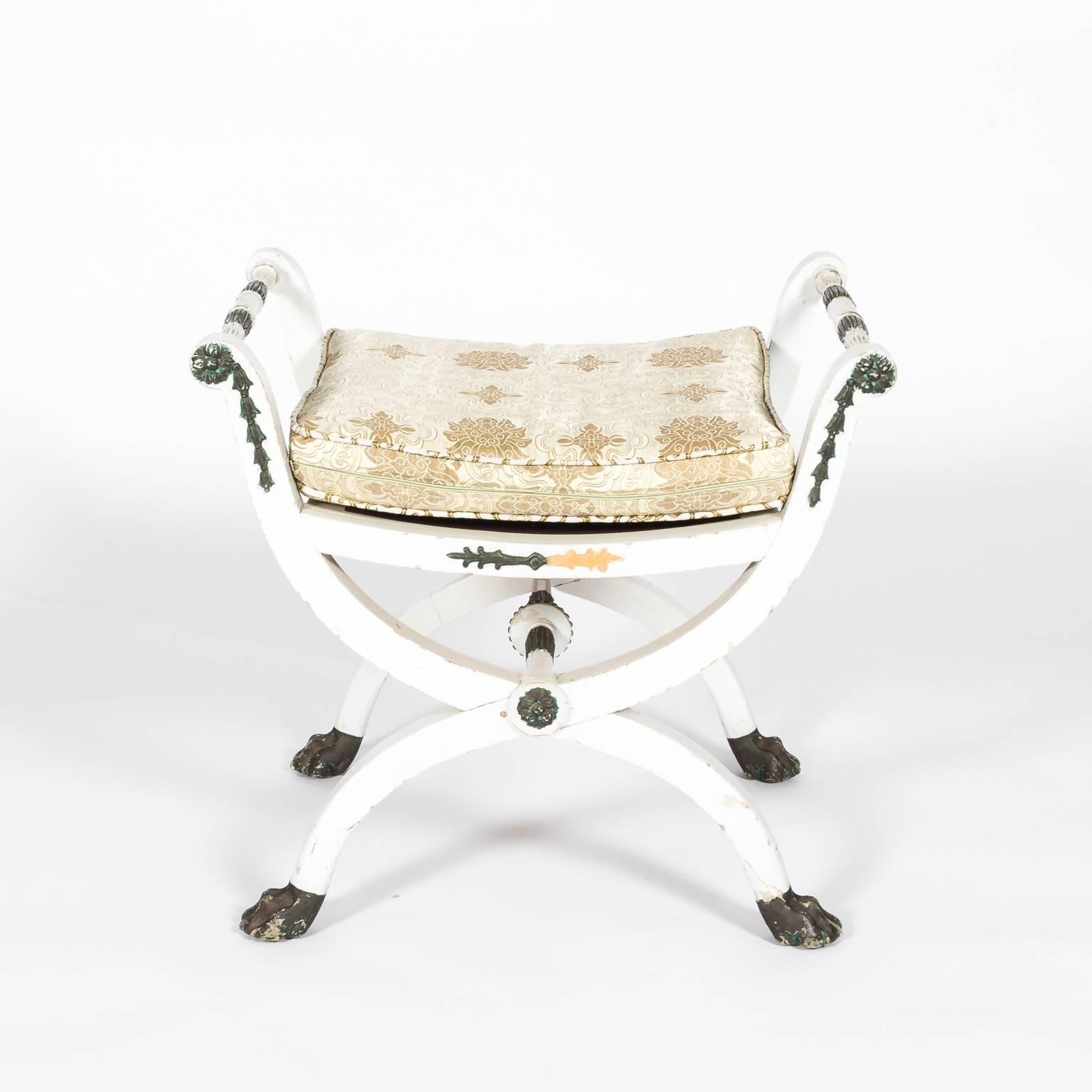 Pair of white painted late Gustavian stools with custom upholstery and curule legs, circa 1794-1820 These chairs are attributed to Ephraim Stahl. One bench is missing front and rear plaster rosettes and bellflowers.
  