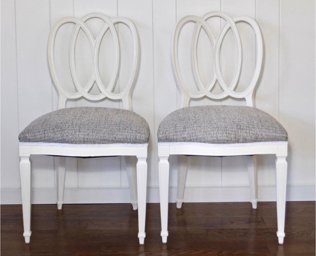 Pair of white painted loop back side chairs. Recently upholstered in grey boucle with white gimp trim.