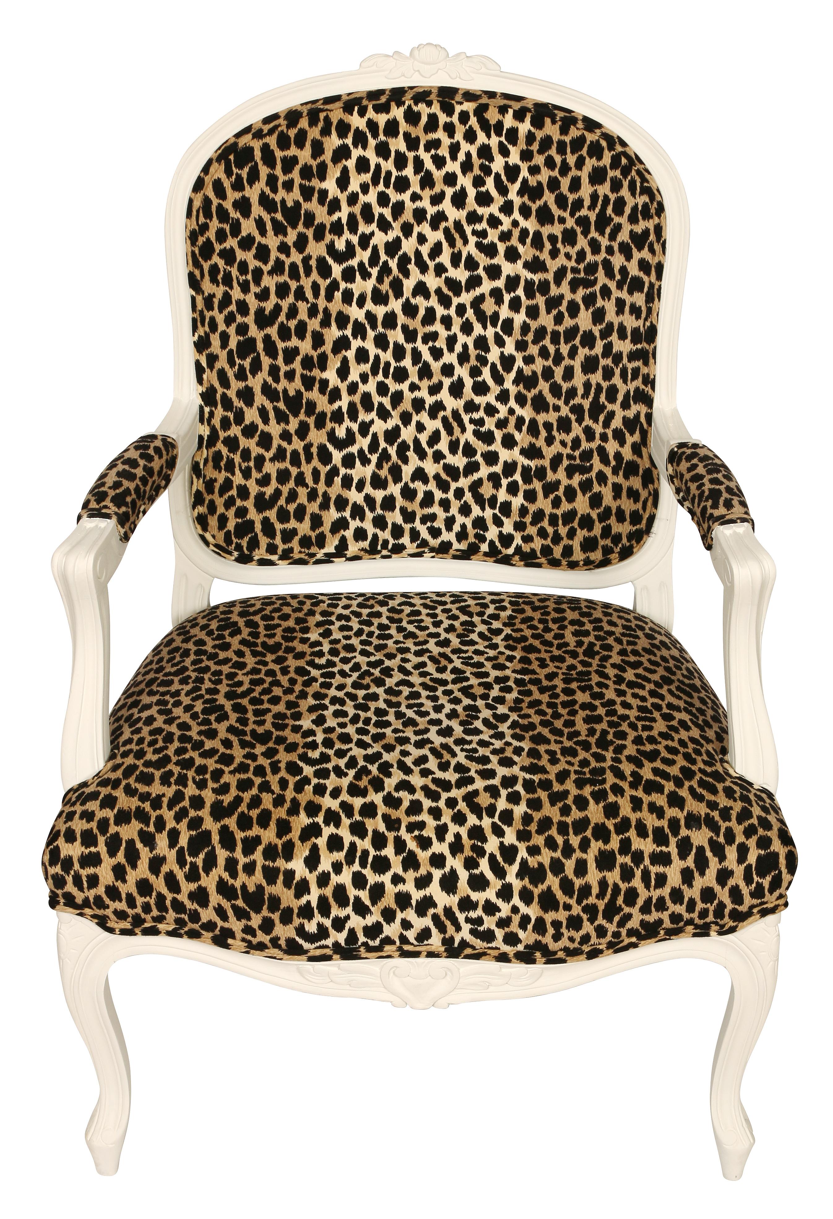 A pair of white painted Louis XV style chairs in leopard fabric. Carved details to chair frame.