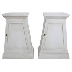 Pair of White Painted Trapezoid Shaped Cabinets