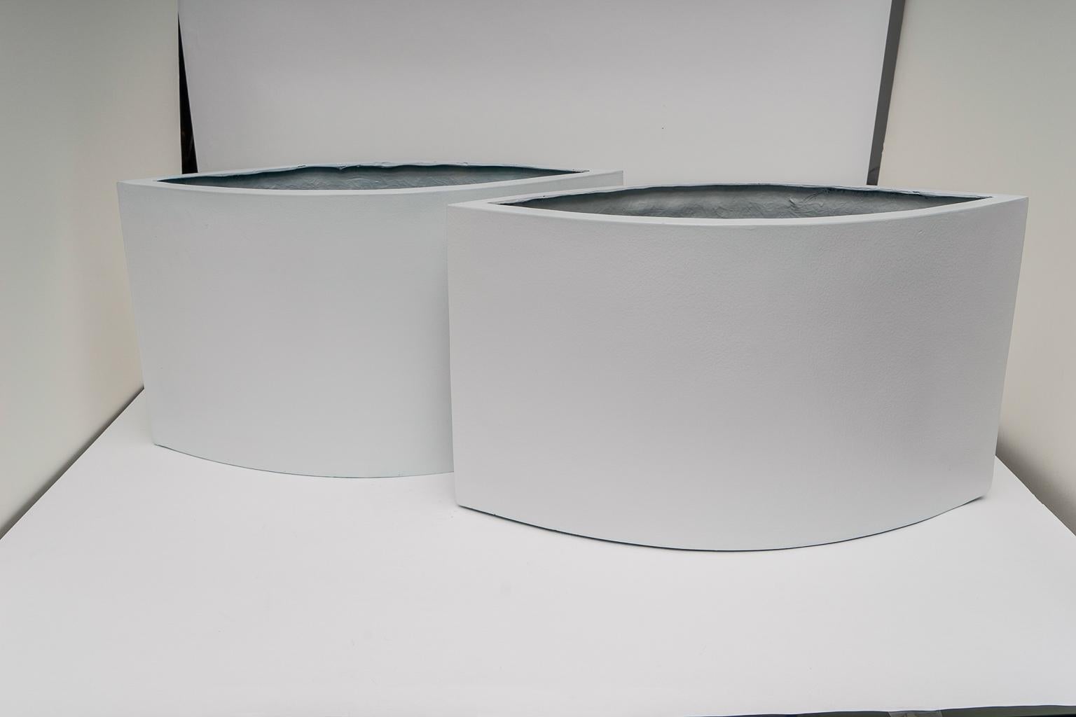 This stylish set of fiberglass planters were acquired from a South Beach (Miami, Florida) estate and they will make a statement with their clean-lines and simple form.

Note: They have drainage holes in the bottom.