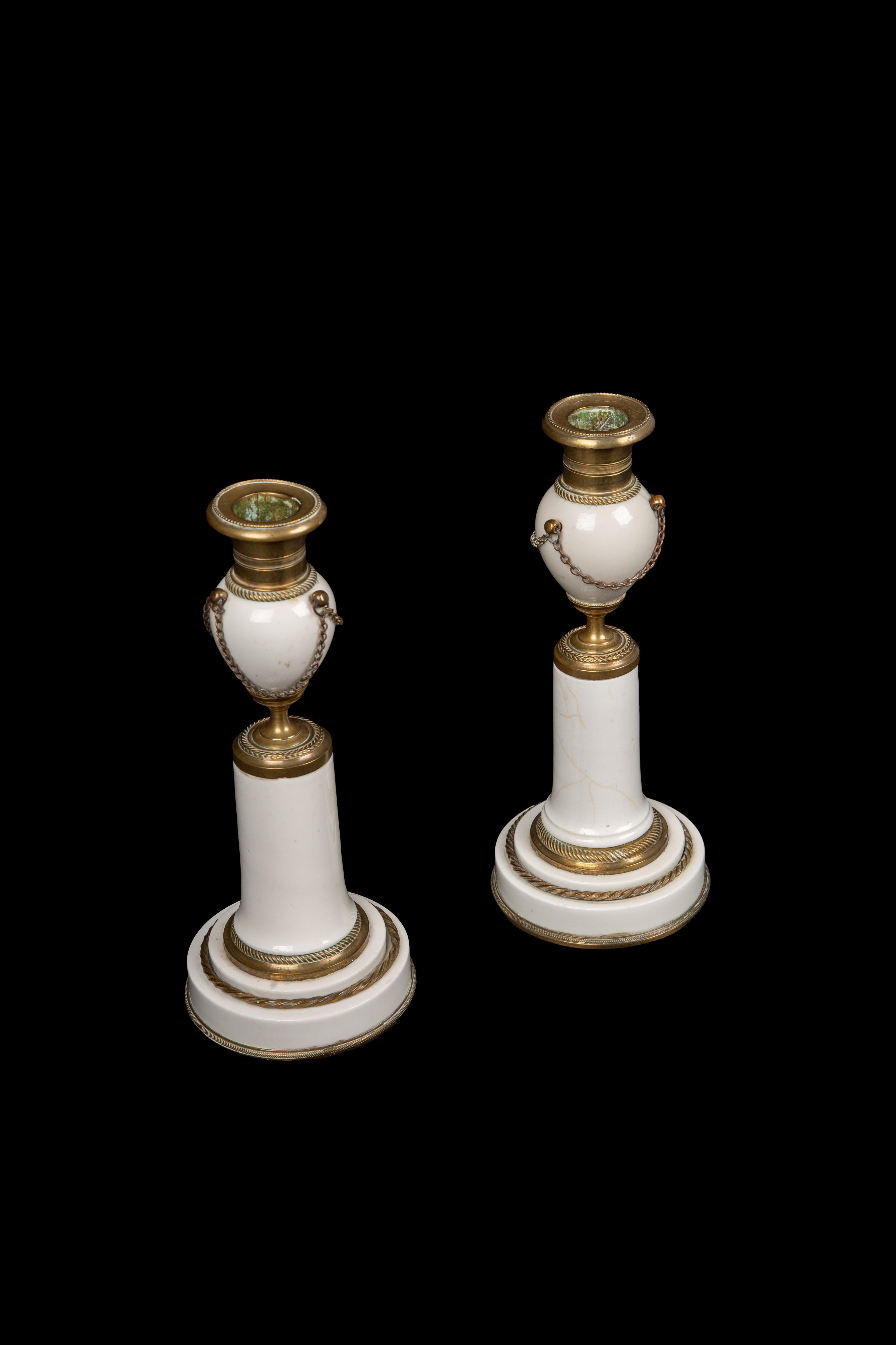 French Pair of White Porcelain and Bronze Candlesticks, From Late Louis XVI Period For Sale