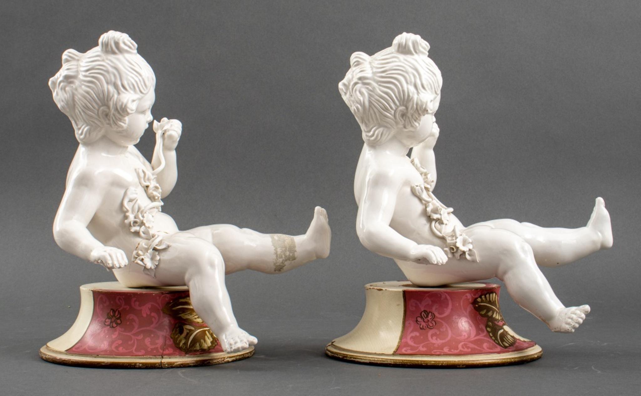 Pair of White Porcelain Cherub Putti Sculptures For Sale 1