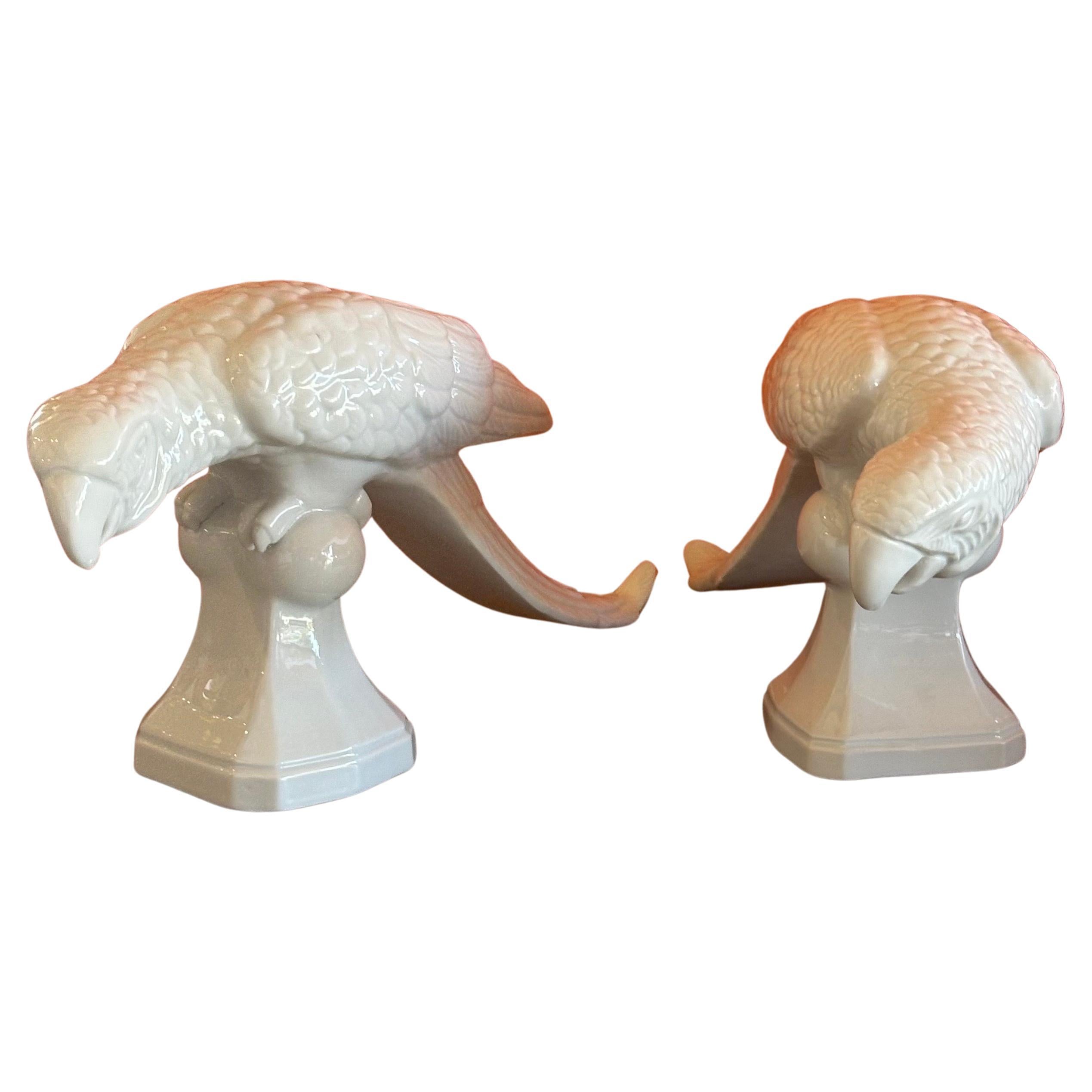 Classic white porcelain / chine de blanc parrot sculptures by Fitz & Floyd, circa 1970s.  The pair are in very good vintage condition with no chips, cracks or crazing; each parrot measures approximately 4.5