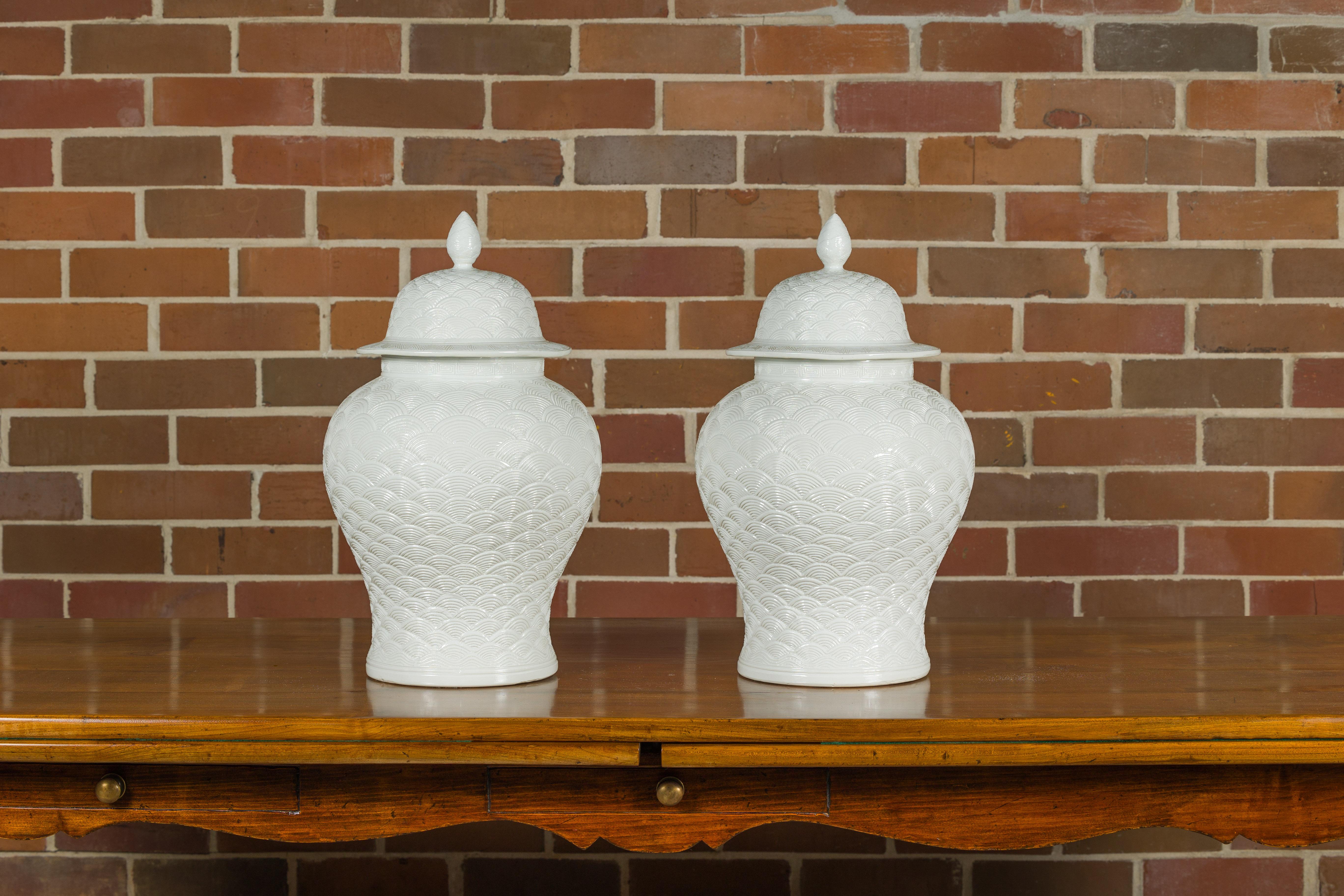 Pair of White Porcelain Fish Scale Lidded Jars with Petite Finials For Sale 1