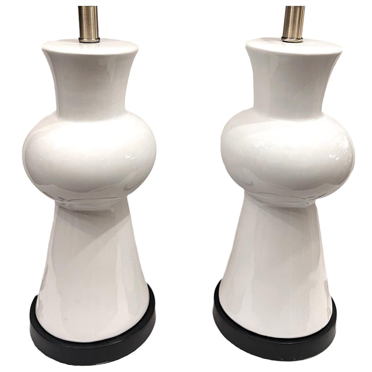 Pair of circa 1960's Italian porcelain lamps with wood bases.

Measurements:
Height of body: 16