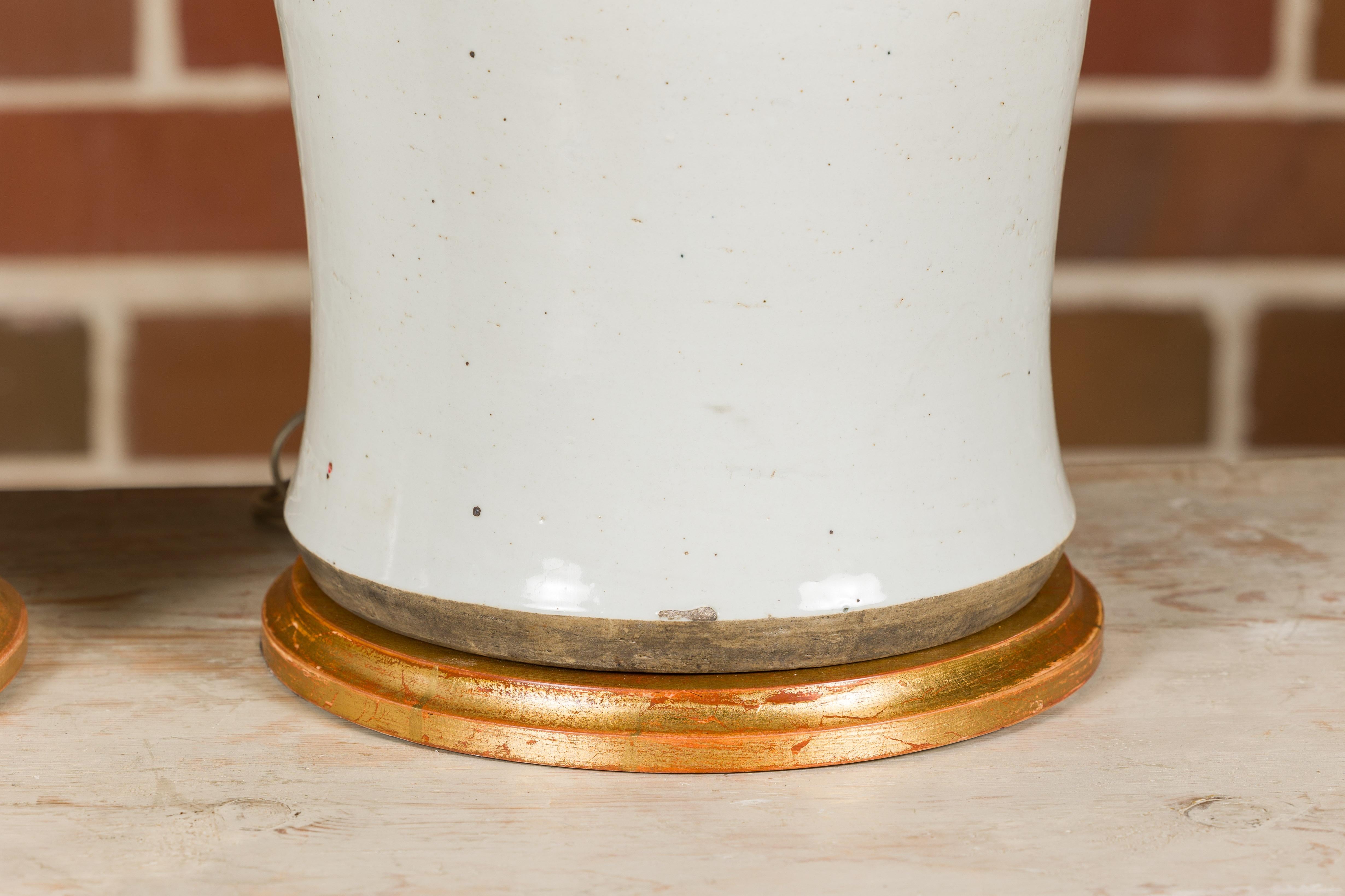 Pair of White Porcelain Lidded Urns Made into Table Lamps on Gilded Bases For Sale 6