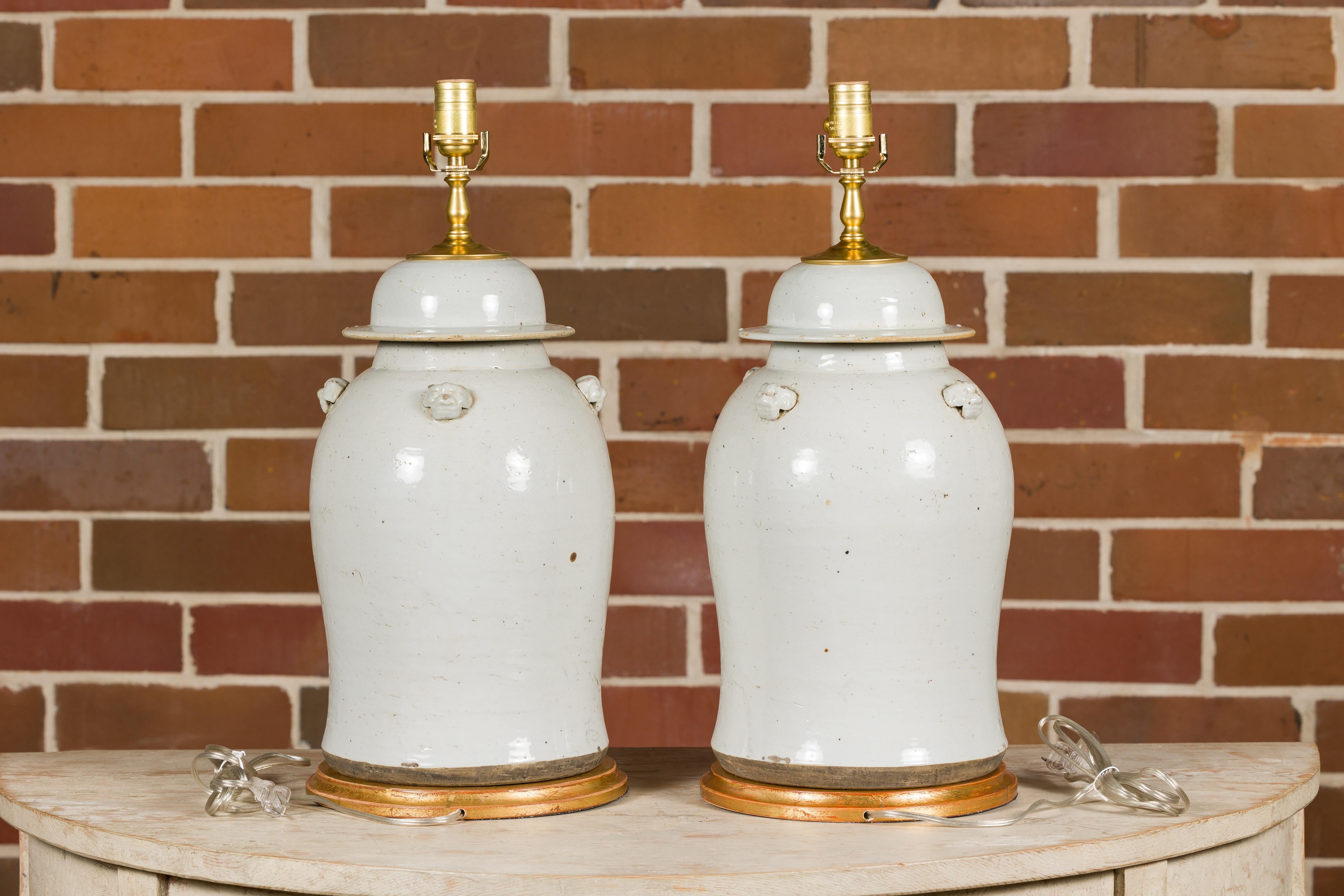 Pair of White Porcelain Lidded Urns Made into Table Lamps on Gilded Bases For Sale 1