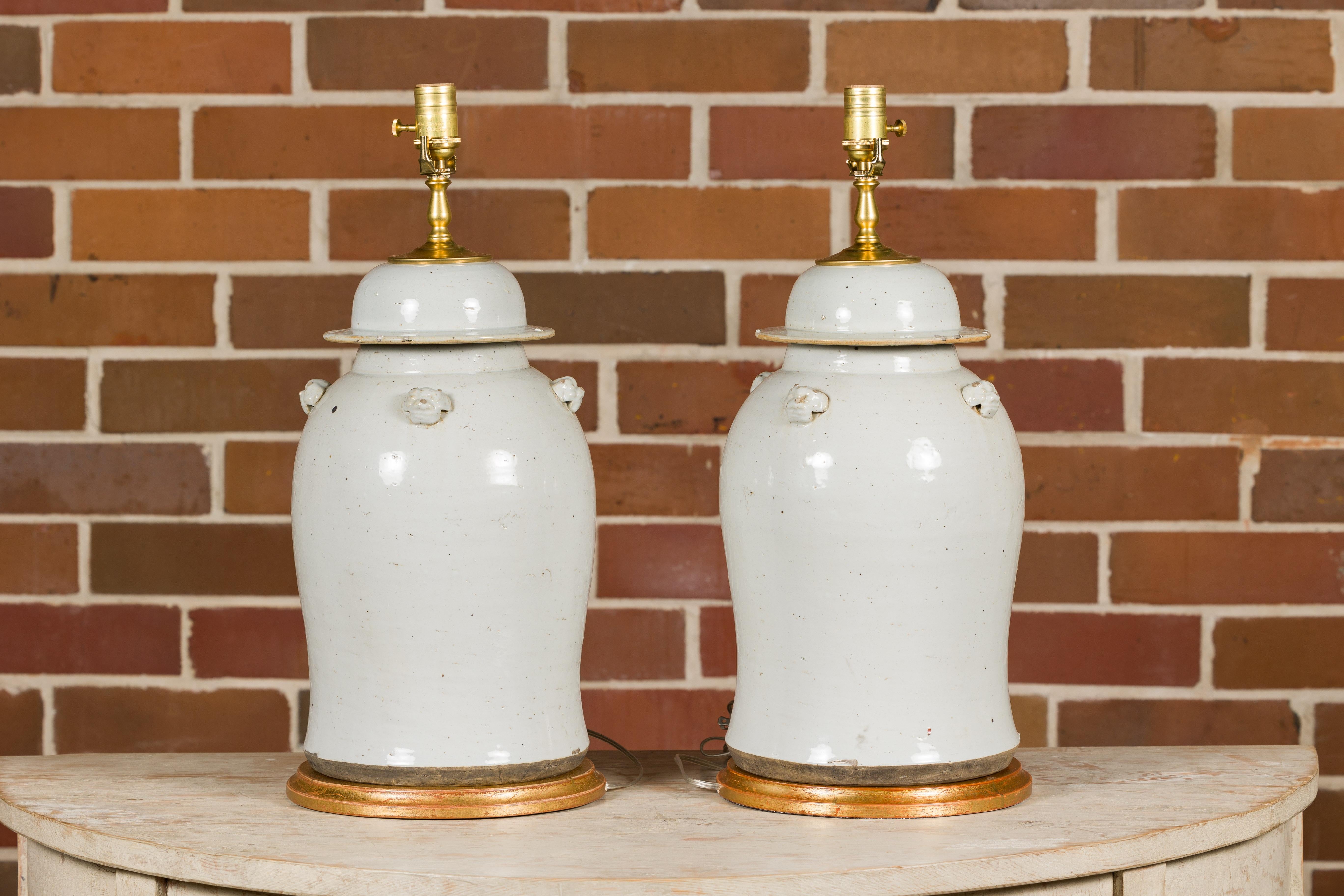 Pair of White Porcelain Lidded Urns Made into Table Lamps on Gilded Bases For Sale 2