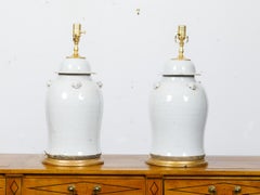Pair of White Porcelain Lidded Urns Table Lamps on Gilt Bases, US-Wired