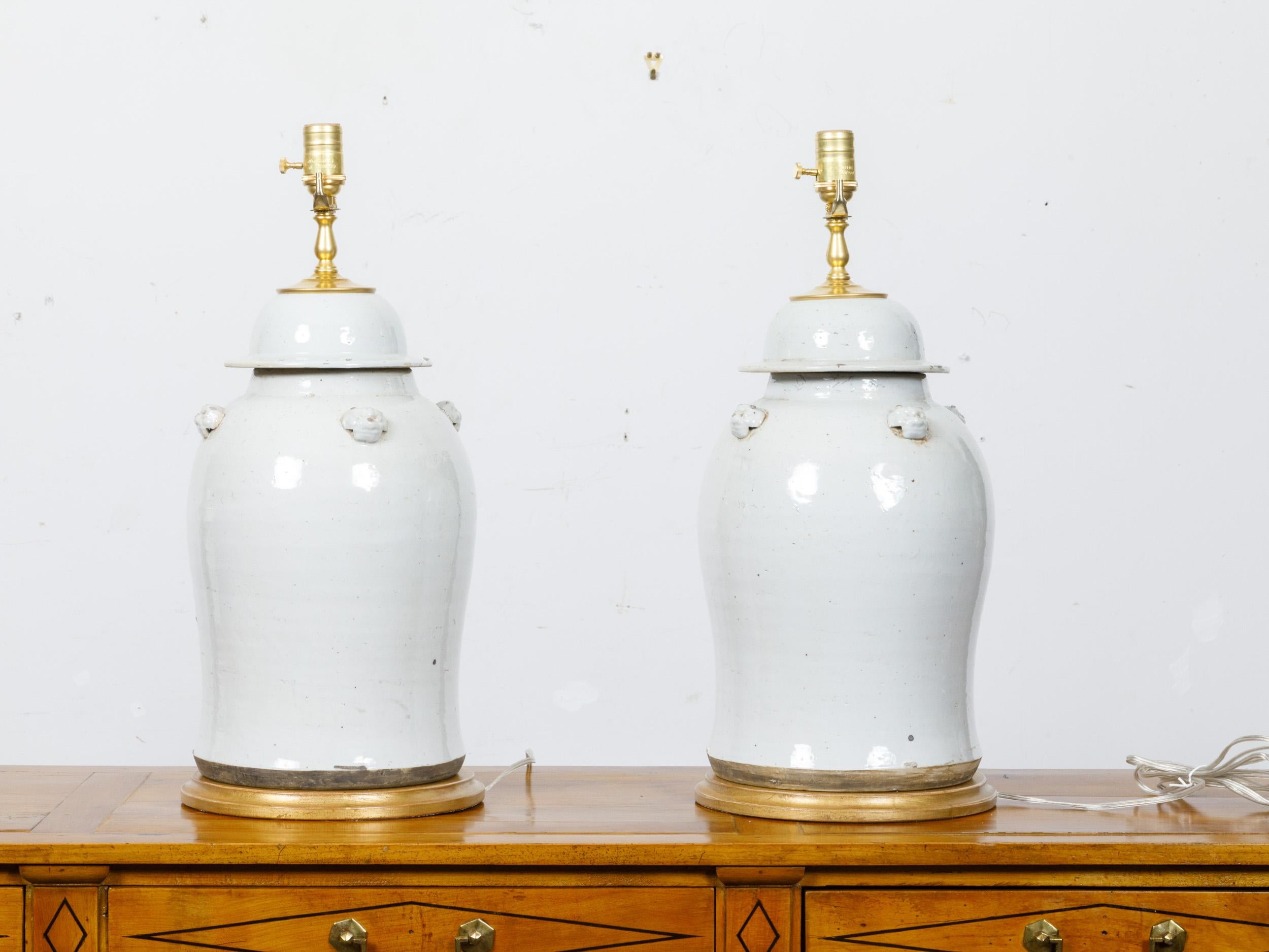 Pair of White Porcelain Lidded Urns Table Lamps on Gilt Bases, US-Wired In Excellent Condition For Sale In Atlanta, GA