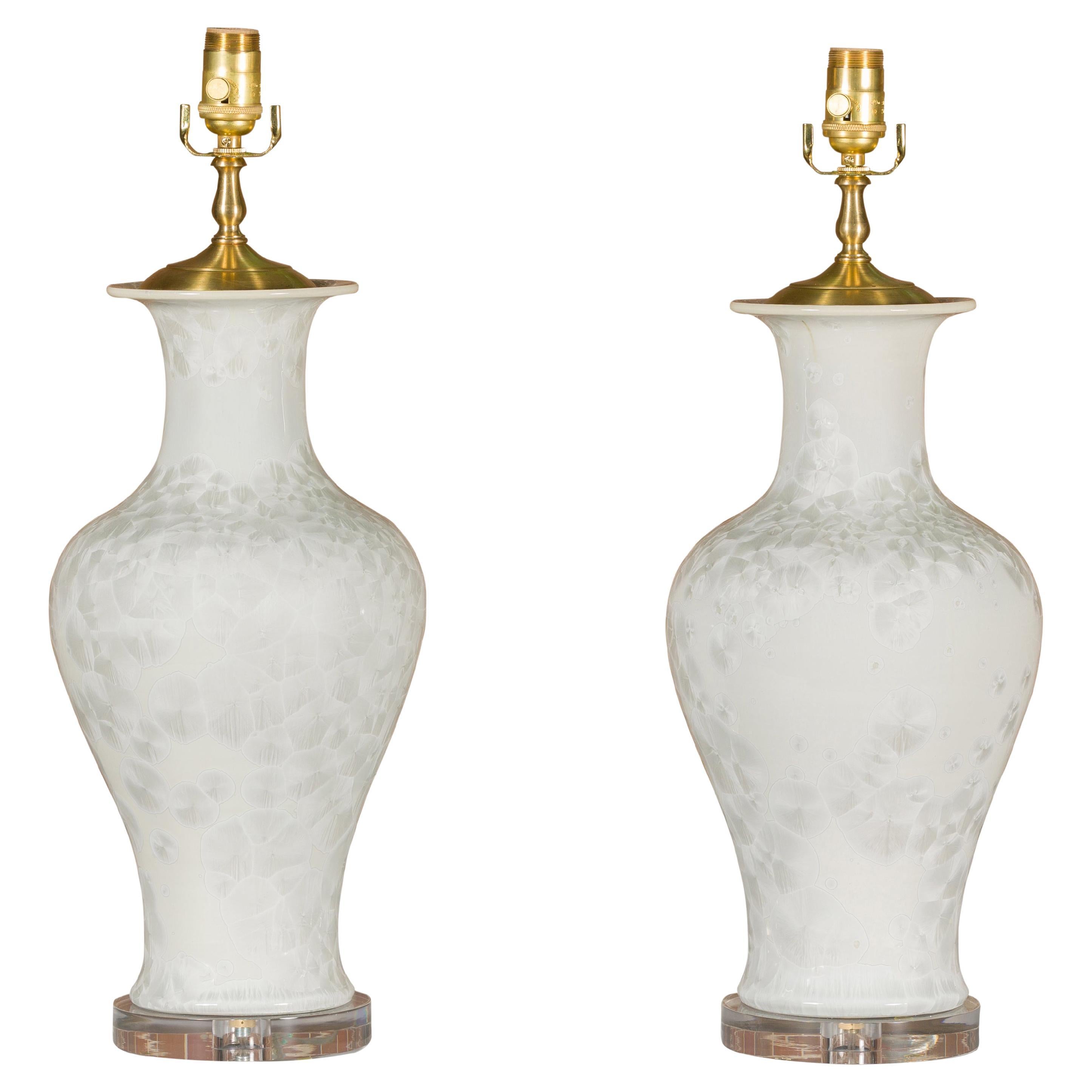 Pair of White Porcelain Vase Table Lamps on Lucite Bases with Textured Décor For Sale