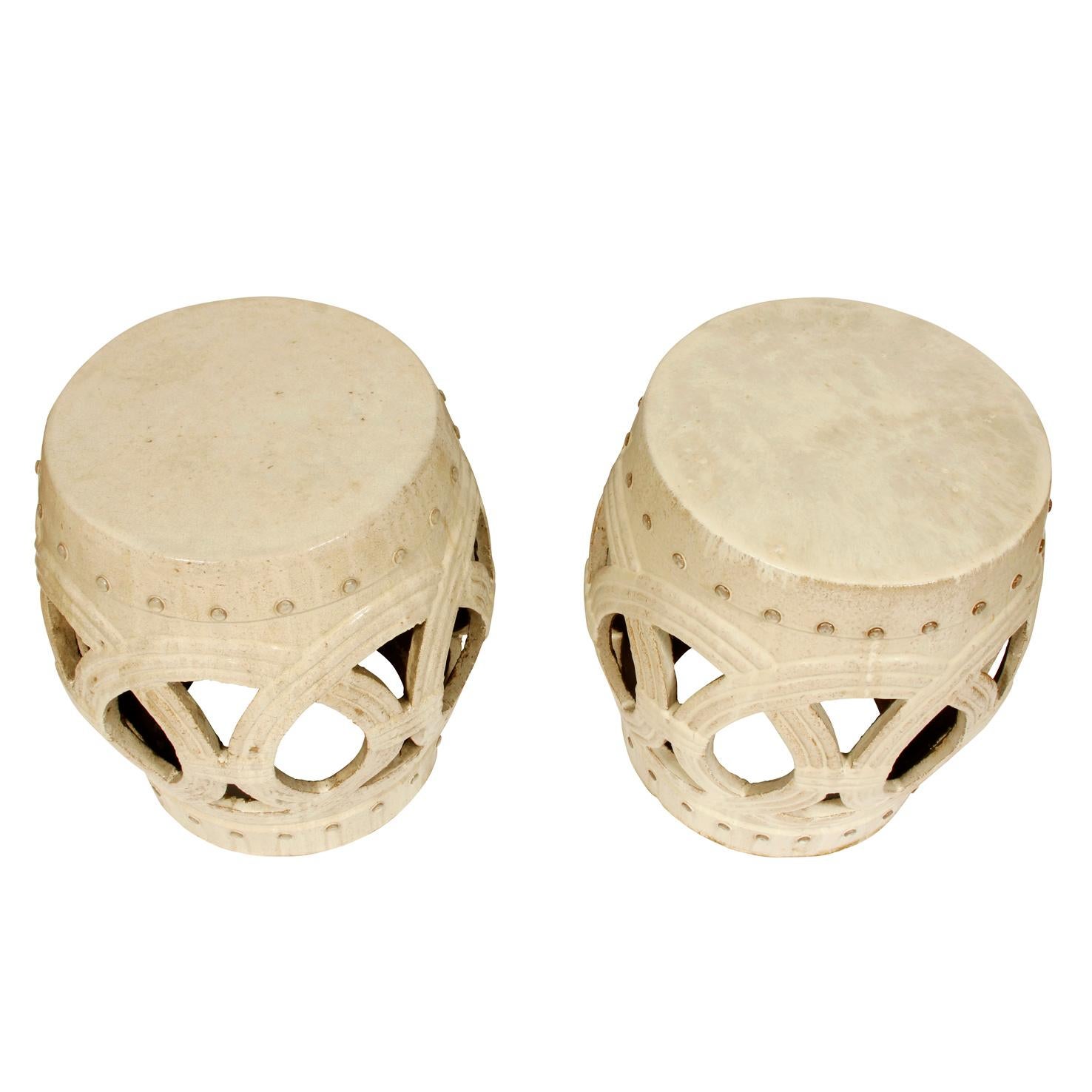 Garden stools are beautiful and versatile, inside or out of doors. This pair, in a creamy white, features an open ring pattern. Perfect for a drinks table in any room and a great way to add a different texture in a room.
