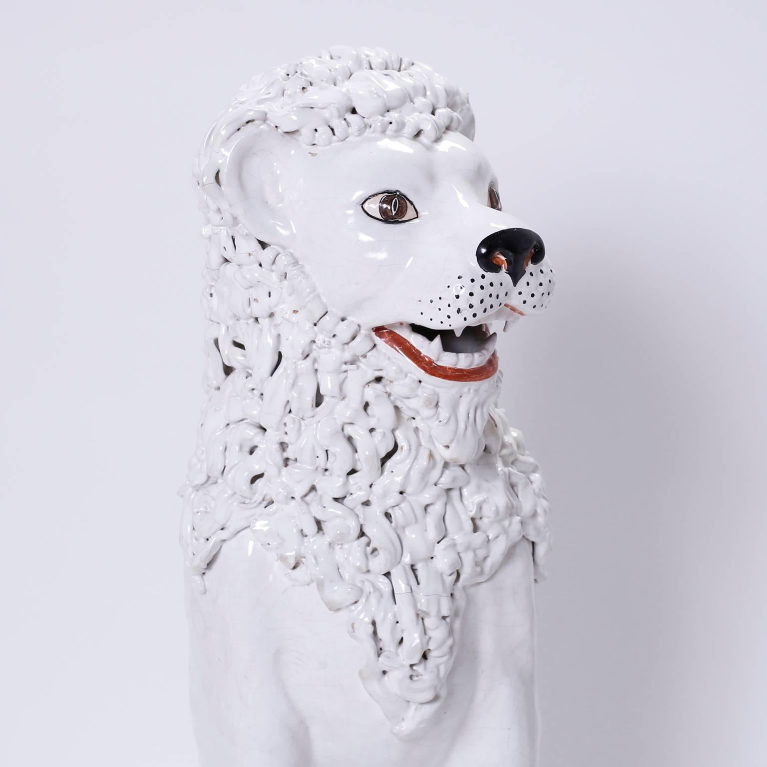 Whimsical pair of Italian midcentury terracotta male and female lions with a white glaze and
painted details. Although hardly ferocious these seated big cats
command attention with their unexpected benevolence and stark white
palette.