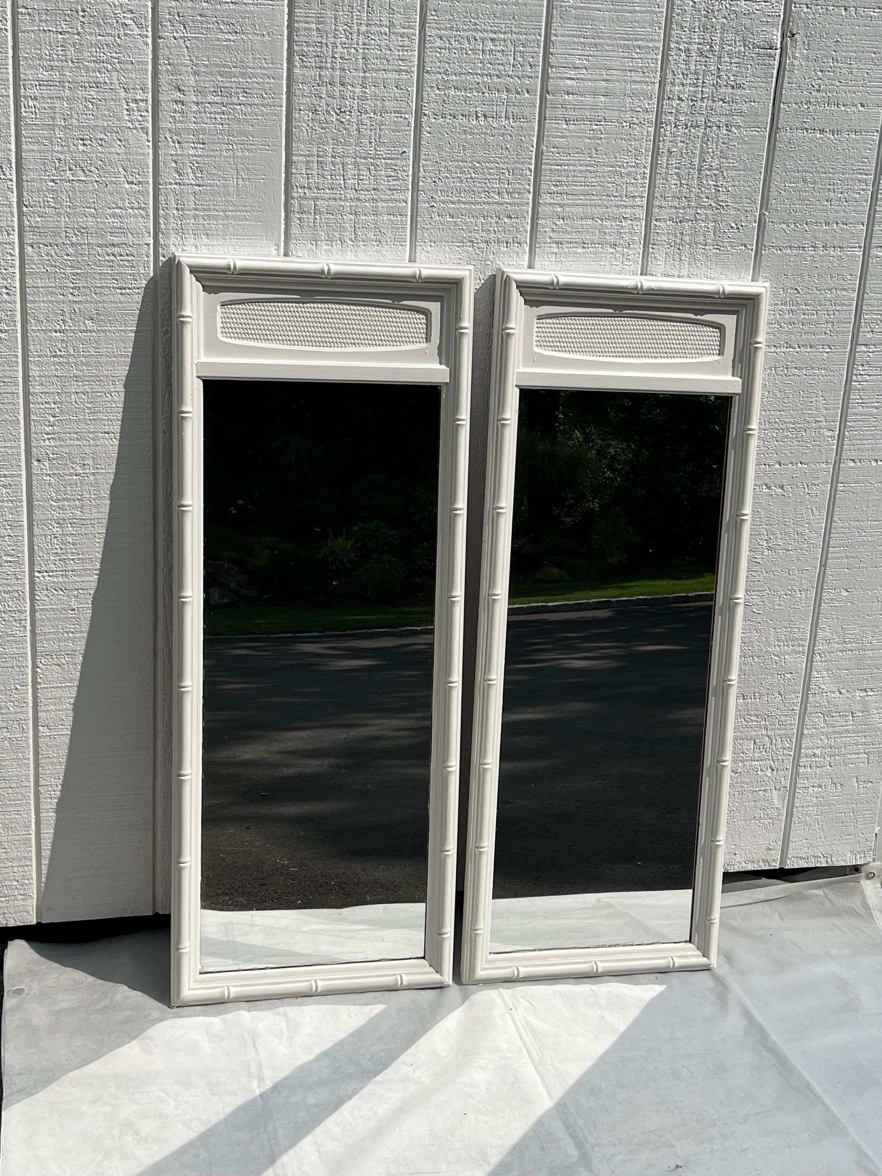 Pair of White Thomasville Faux Bamboo Mirrors. Classic tall and narrow mirrors with bamboo accent and white wicker. Perfect for over a double vanity or powder rooms. 
Orignally was over a large wide Thomasville dresser.  Sold as a pair. Can possibly