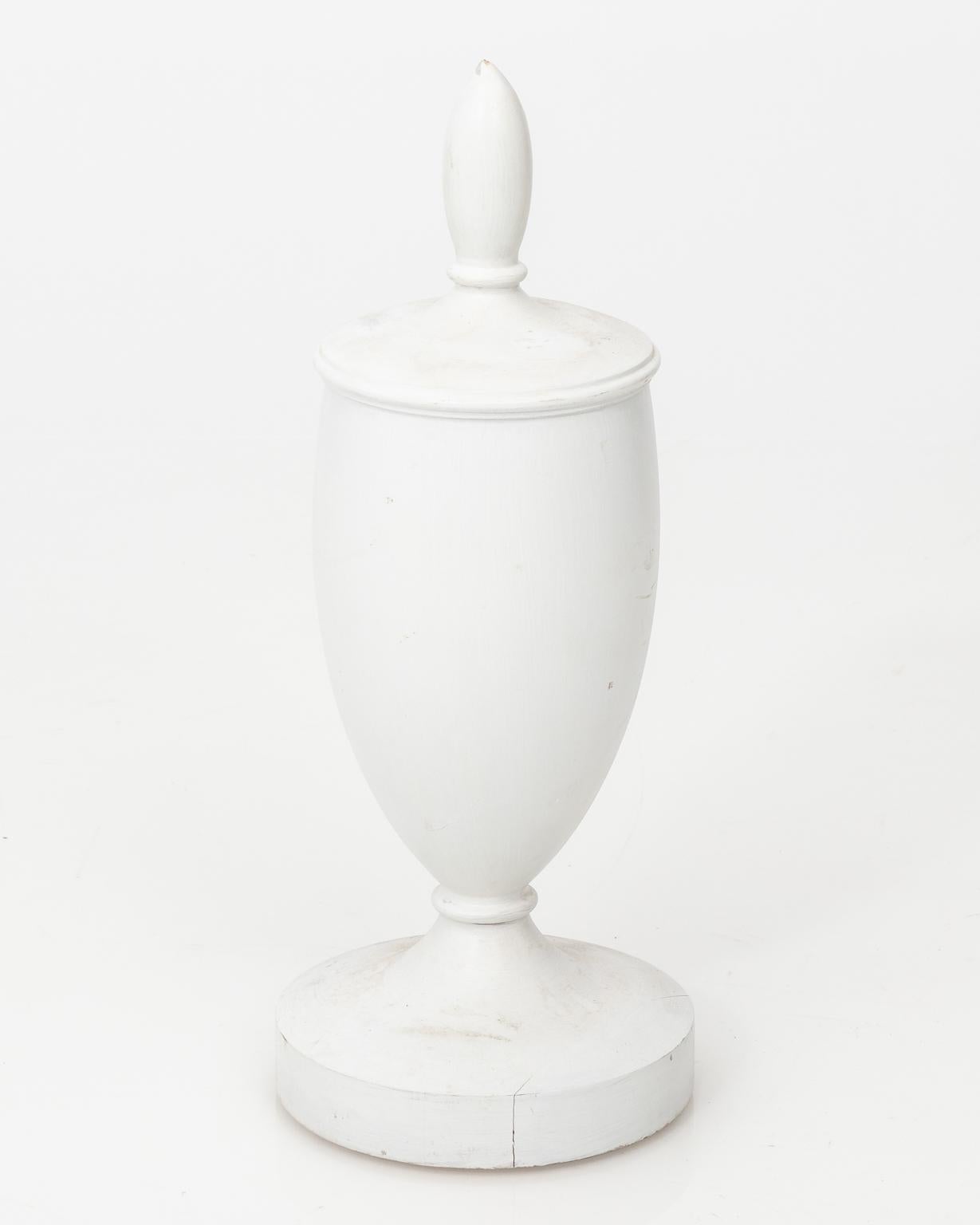 Contemporary pair of white painted wooden urn finials.
 