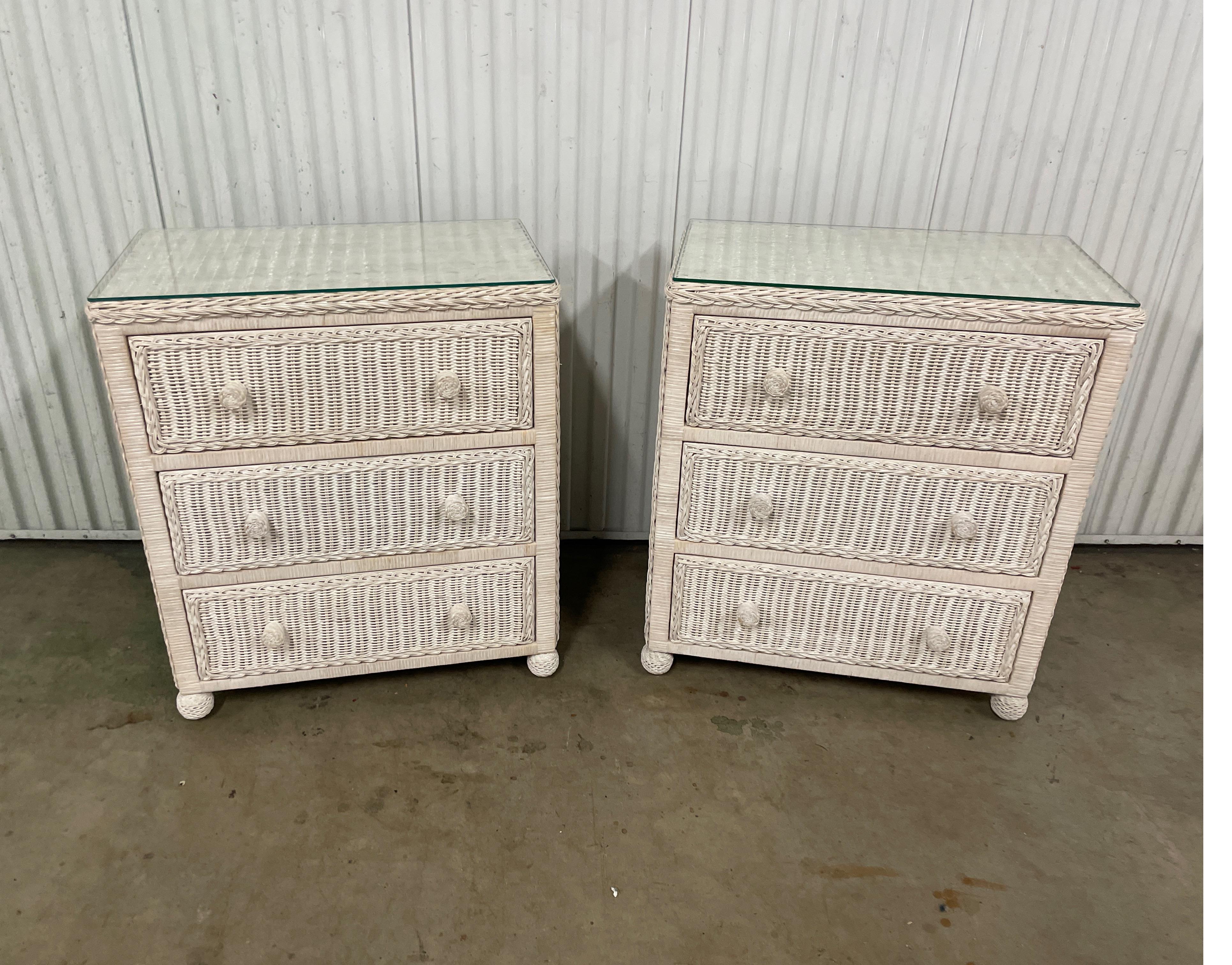 Pair of white wicker three drawer nightstands / dressers. These nice cottage chests will work well as either large nightstands or a pair of smaller dressers. They are well constructed and in very good condition.