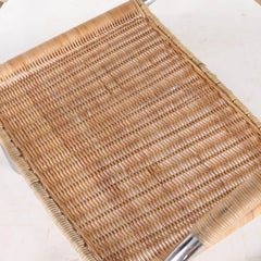 Pair of wicker and chrome armchairs