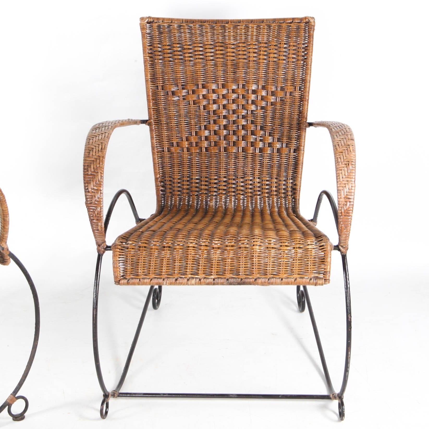 Rare pair of vintage hand woven rattan and iron armchairs. Probably French from the seventies. Unusual sled legs.
Very comfortable and in good condition. 
2 pairs available. 