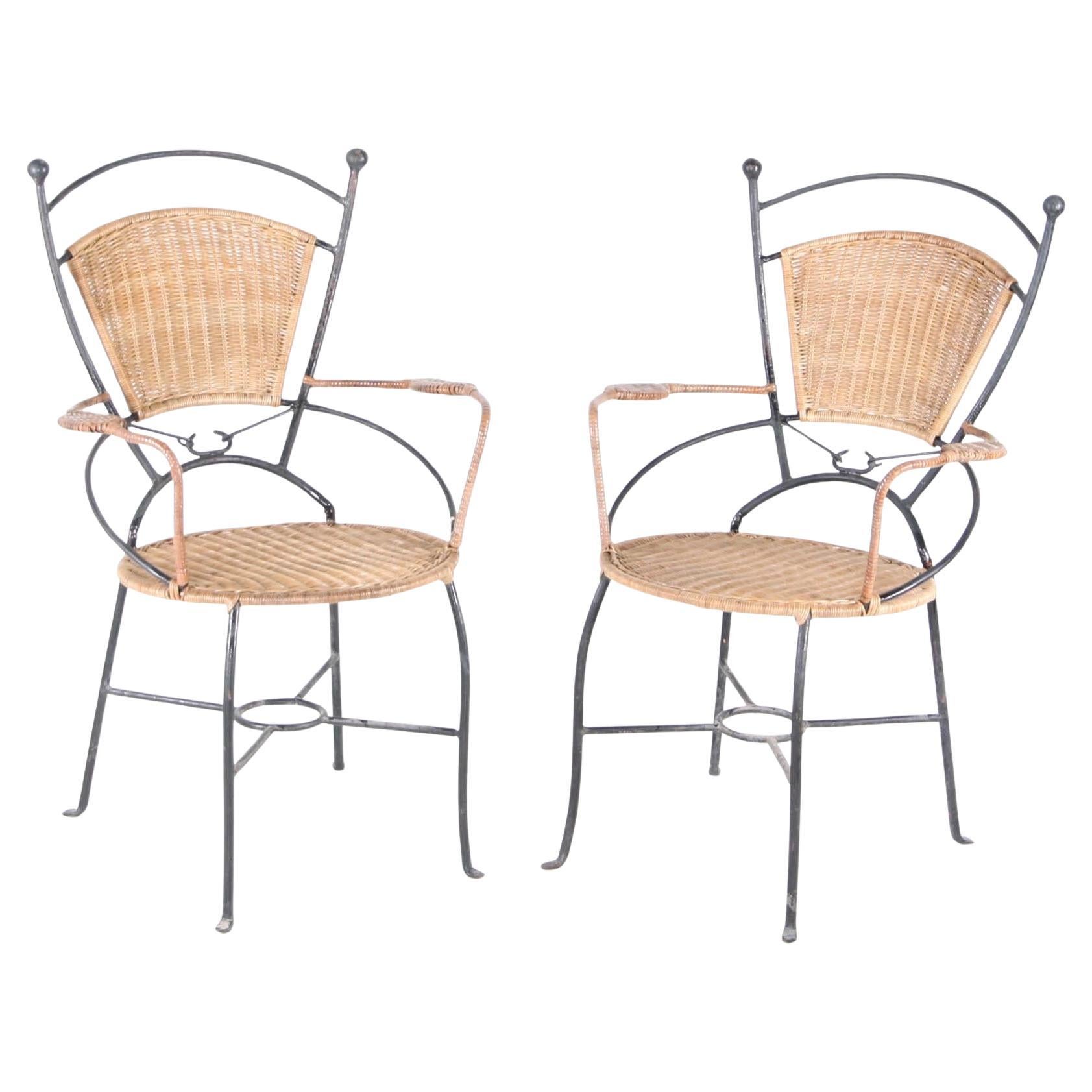 Pair of wicker and iron armchairs