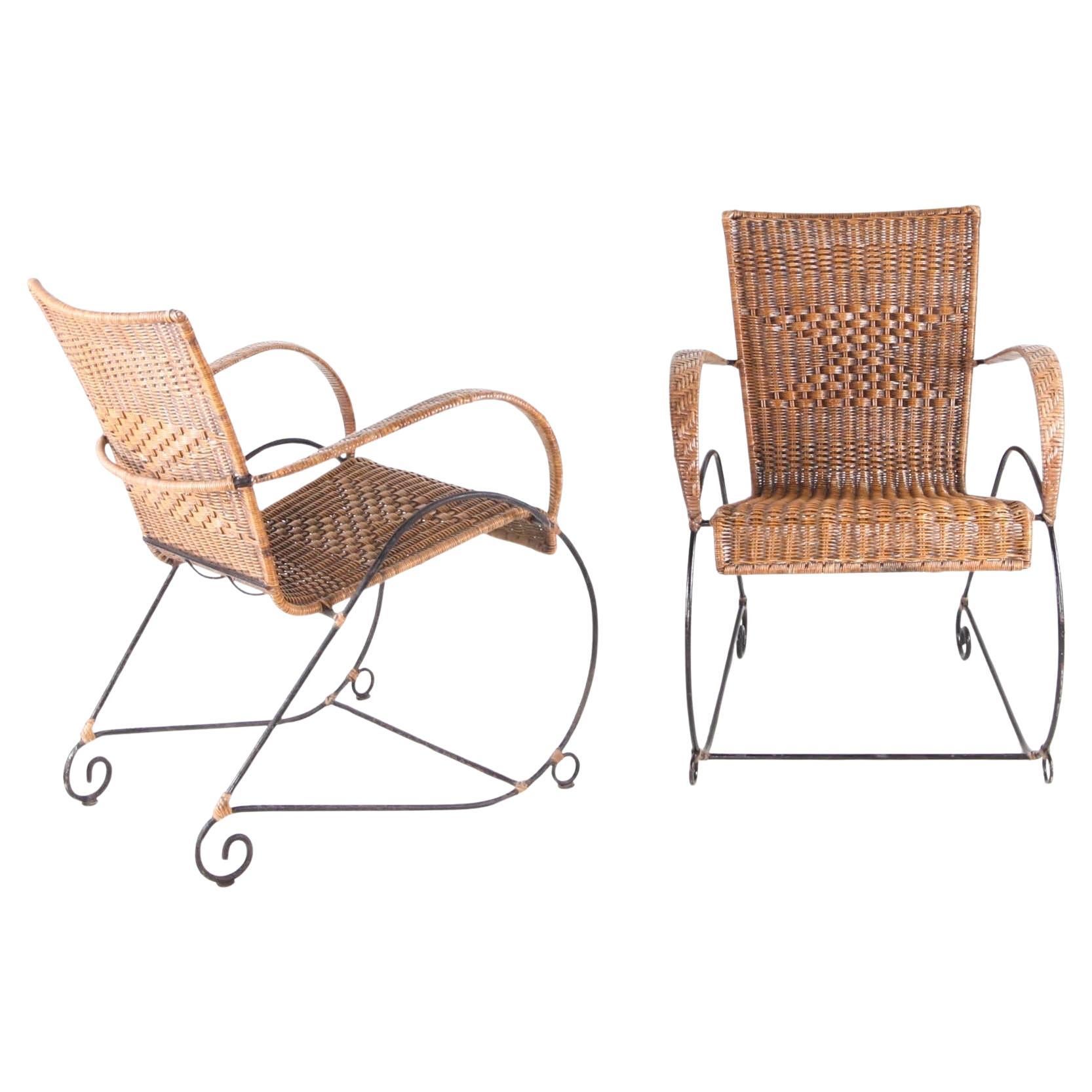 Pair of wicker and iron armchairs